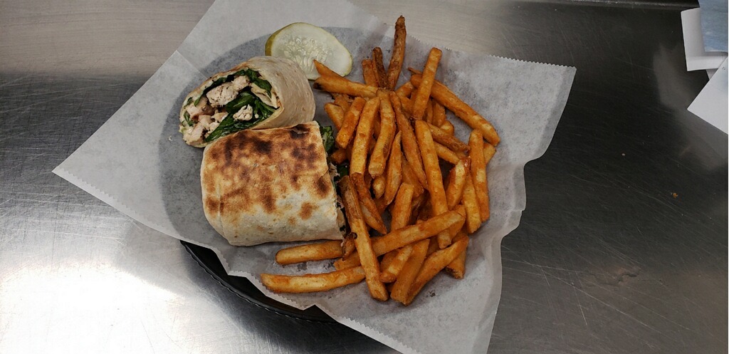 Order Chicken Caesar Wrap food online from 1st Place Sports Bar store, Hoffman Estates on bringmethat.com