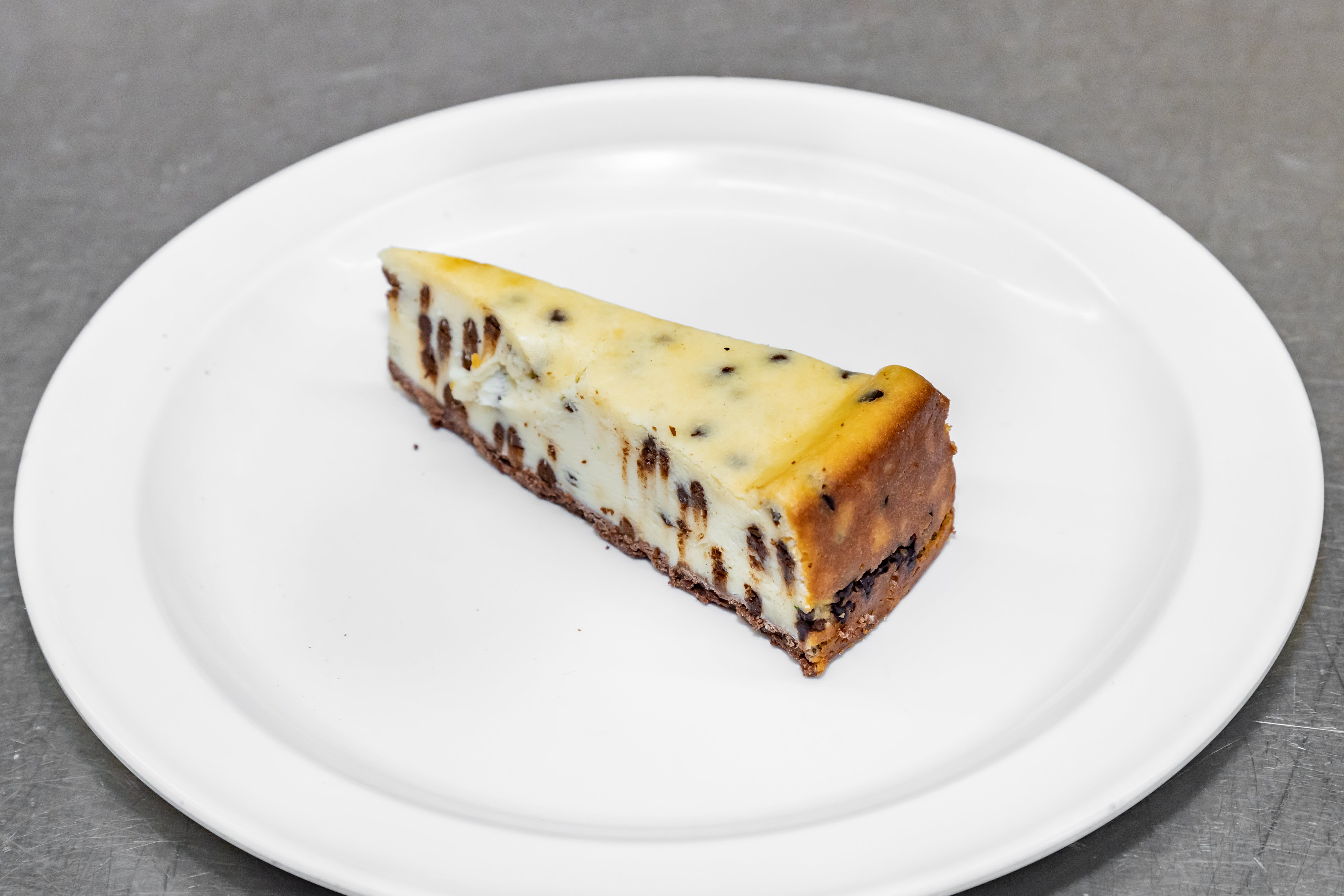 Order Eli's Chocolate Chip Cheesecake - Dessert food online from Luconi's Pizza store, Bradley on bringmethat.com