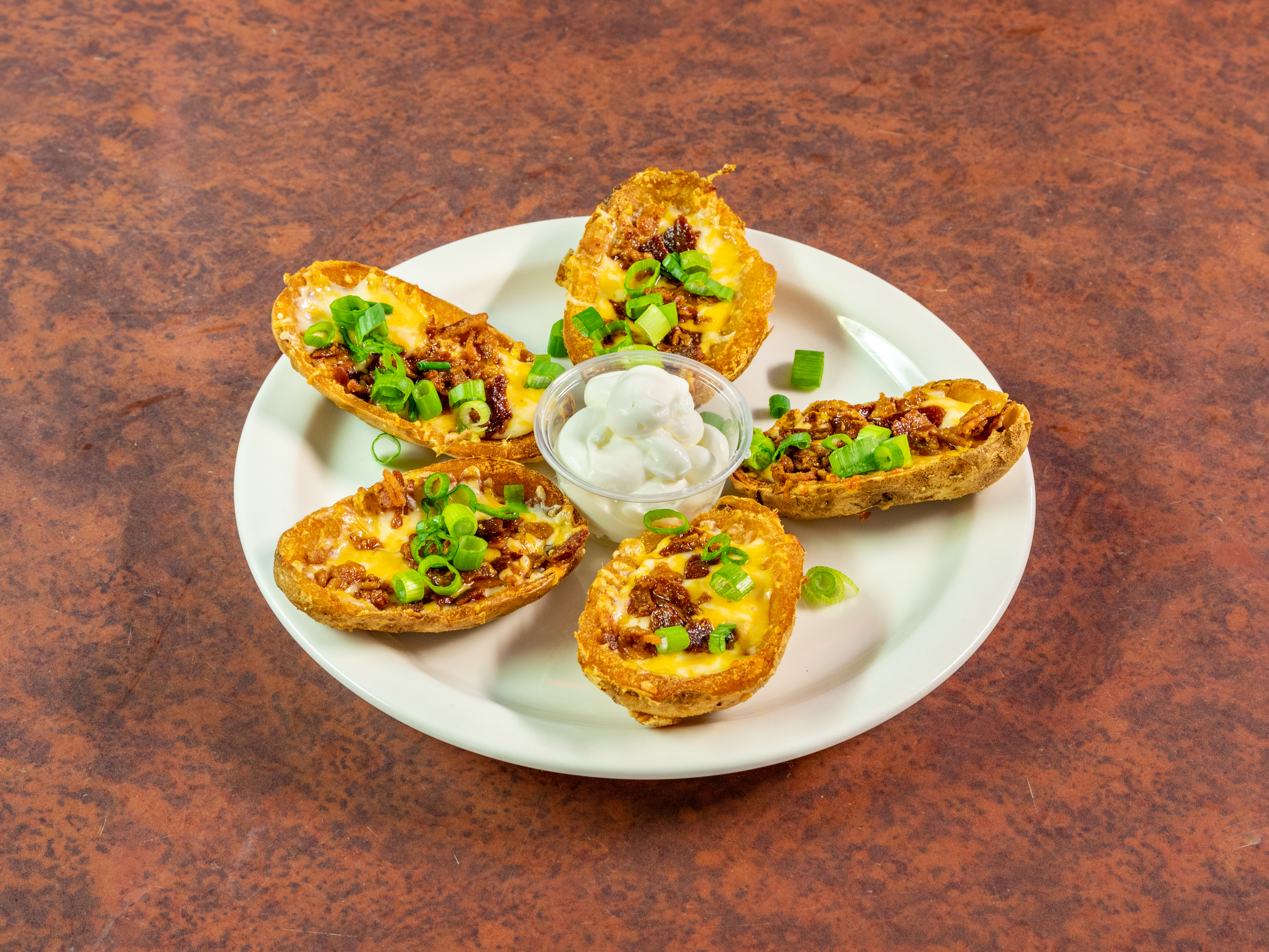 Order Loaded Potato Skins food online from Tailgaters Sports Bar & Grill store, Glendale on bringmethat.com