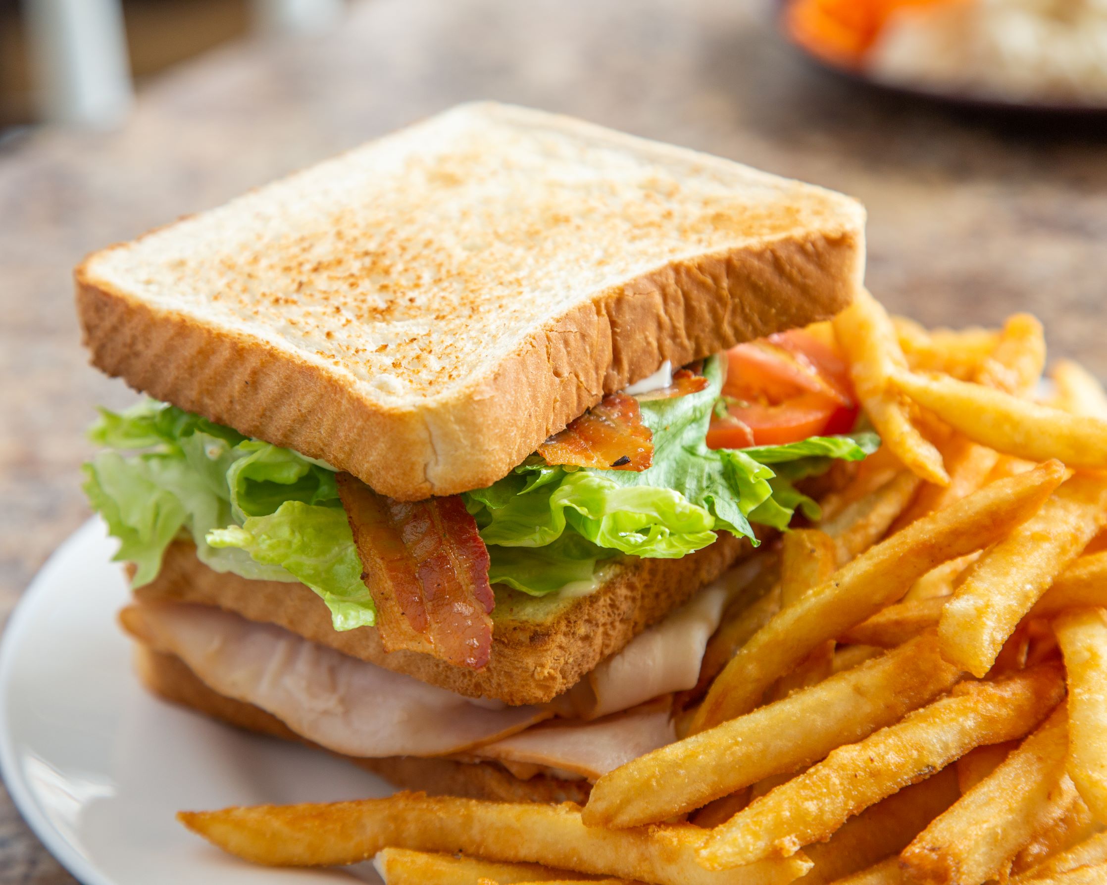 Order Turkey Club Sandwich food online from Andalus Pizza & Cafe store, Brighton on bringmethat.com