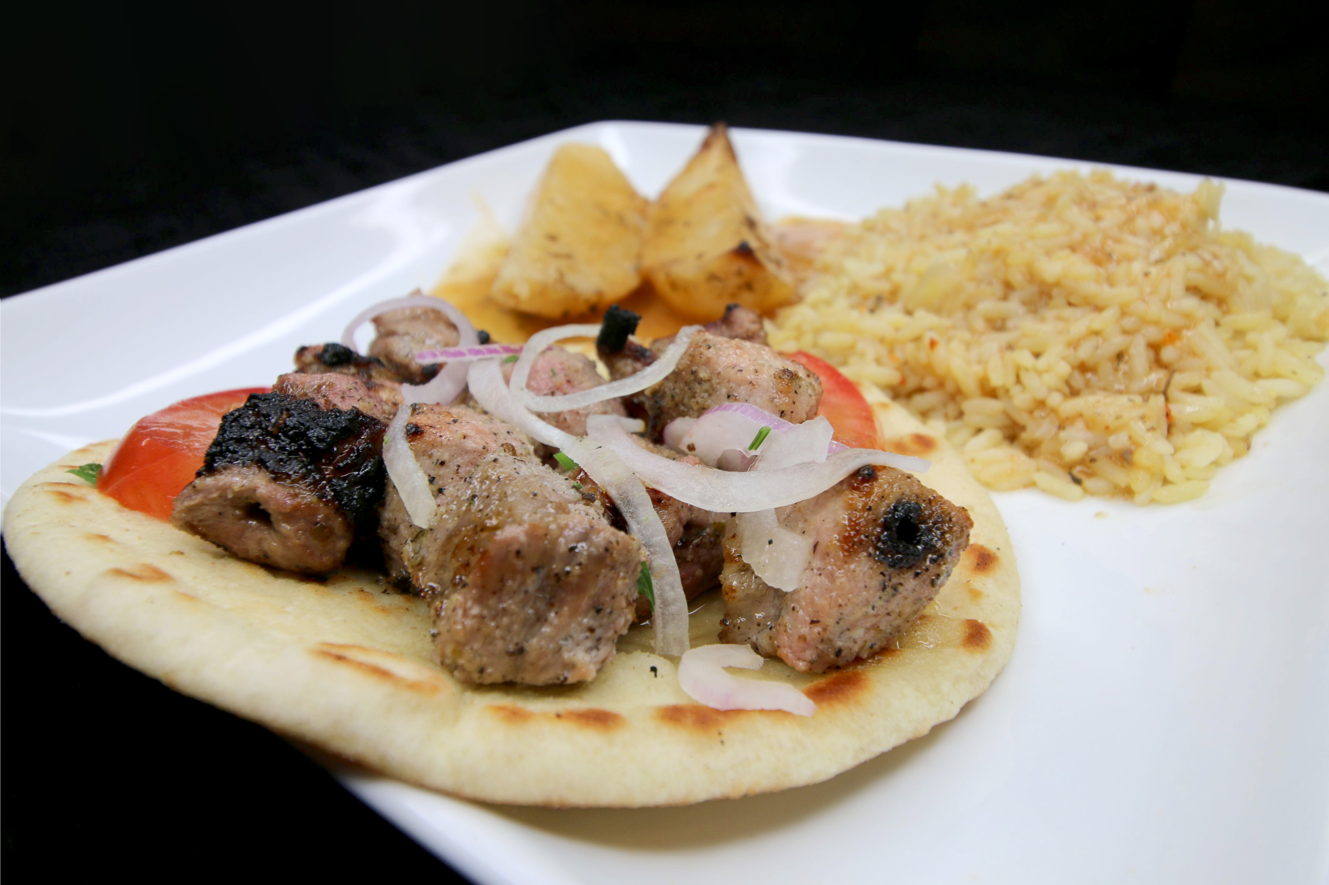 Order Pork Souvlaki Plate food online from Ambrosia Greek Eatery store, Bartlett on bringmethat.com