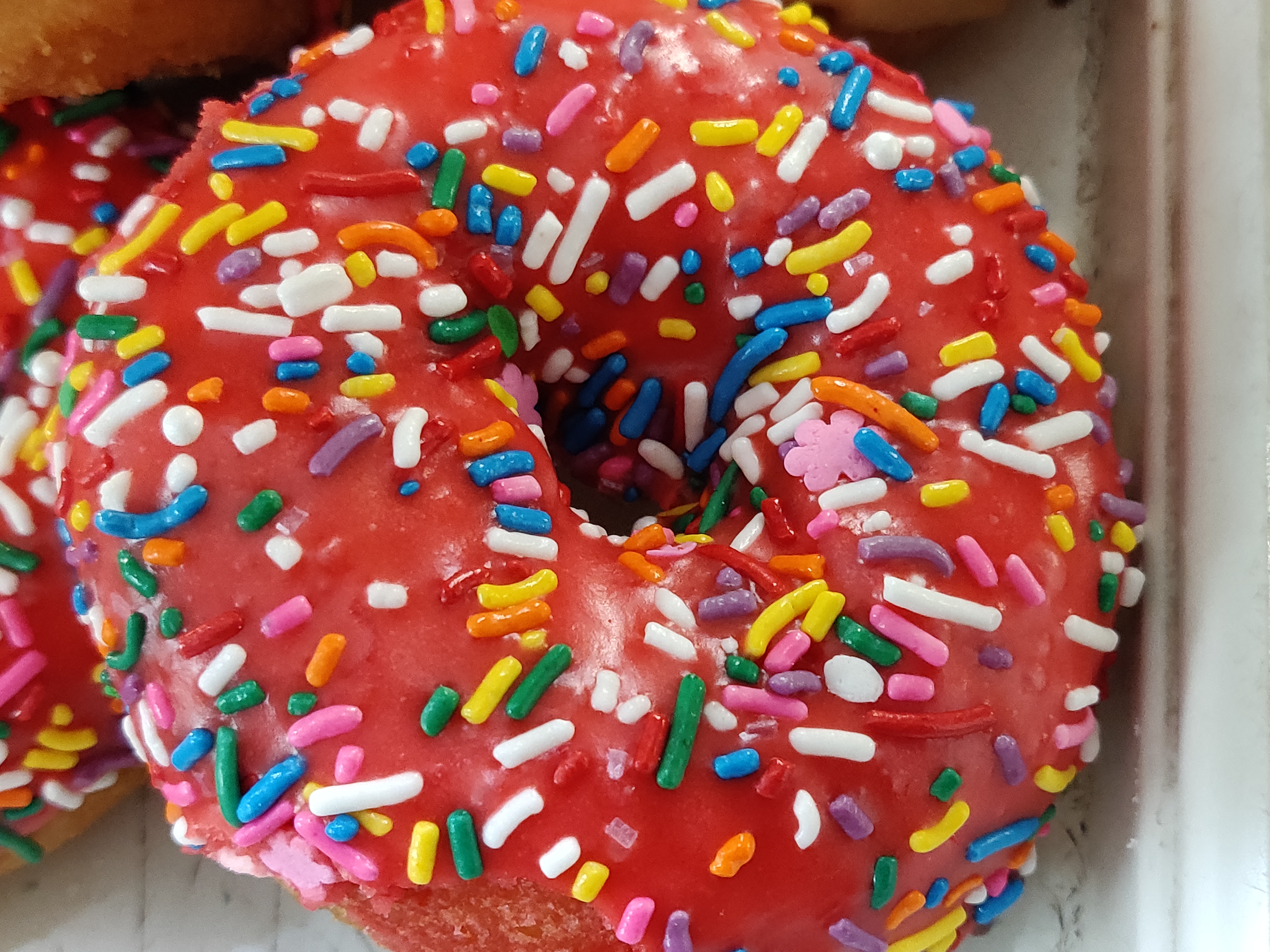 Order Rainbow Sprinkle Strawberry Icing Cake food online from Donut Club store, San Dimas on bringmethat.com