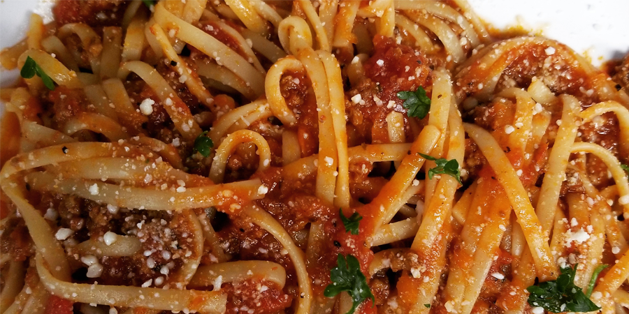 Order Pasta with Meat Sauce food online from The Pizzeria - W. University Dr. store, Edinburg on bringmethat.com