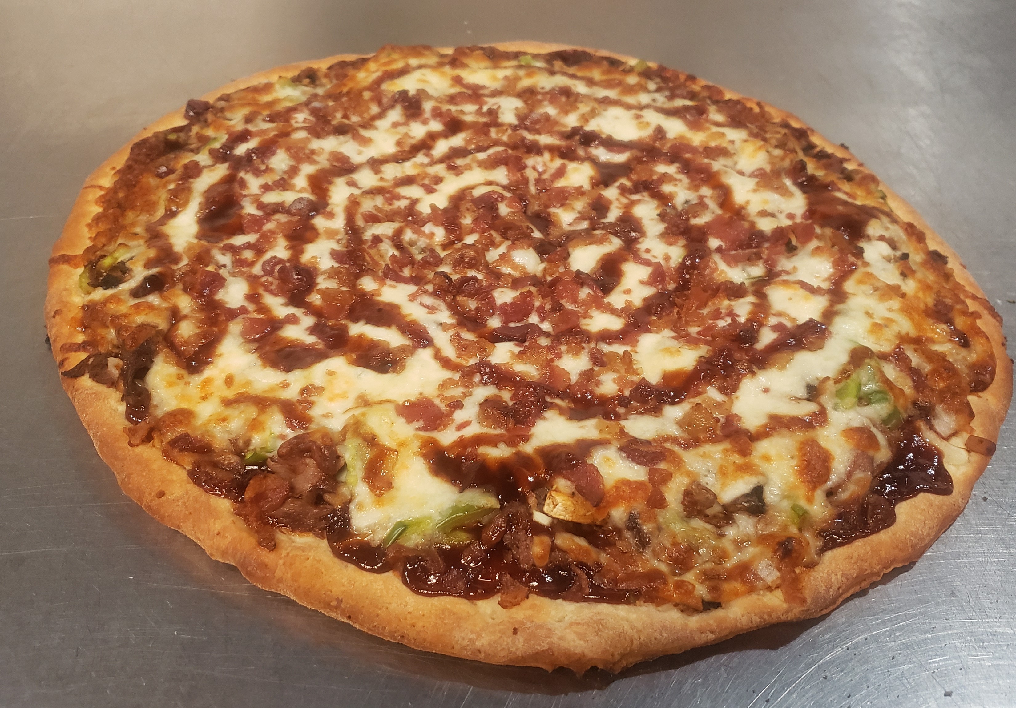 Order BBQ Western Pizza food online from Village Pizza store, Chicago on bringmethat.com