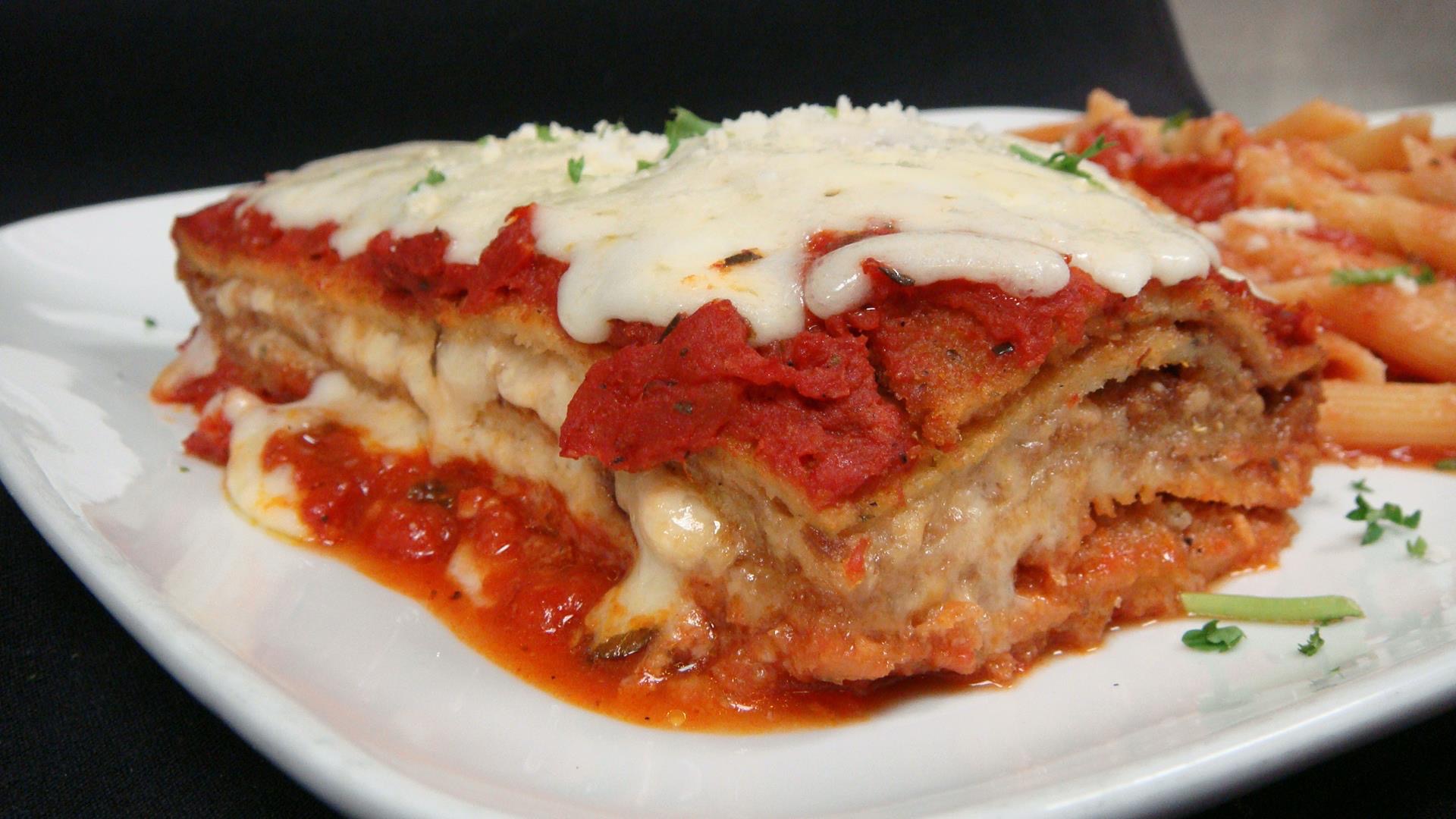 Order Eggplant Parm food online from Capone's Pizzeria store, Bloomingdale on bringmethat.com