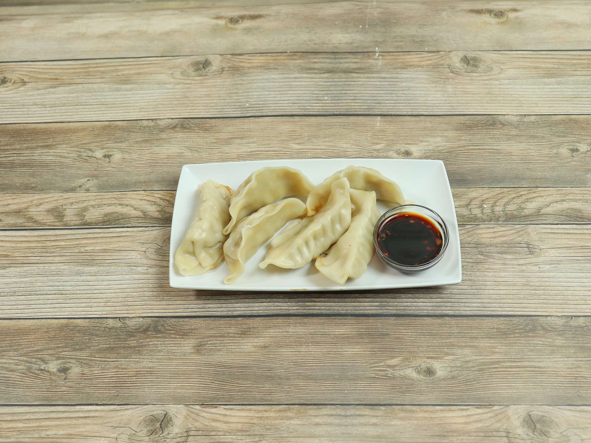 Order A5. Steamed Pot Stickers food online from Green China Cafe store, Suwanee on bringmethat.com