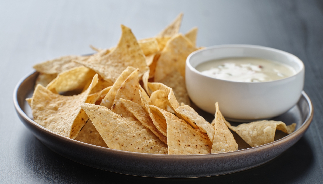 Order Melted Queso Dip and Chips food online from Mexican Mariachi Grill store, Glassboro on bringmethat.com
