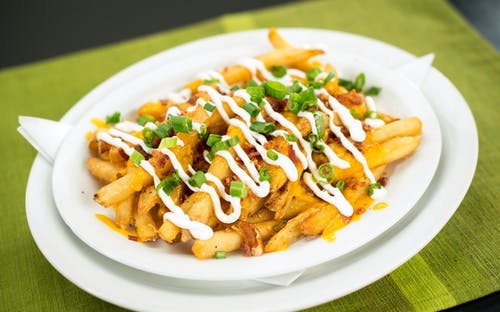 Order Loaded Fries - Appetizer food online from Native Grill & Wings store, Phoenix on bringmethat.com