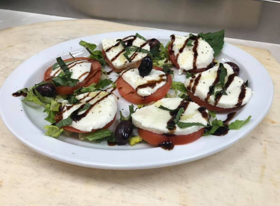 Order Caprese Salad - Large food online from Bella Napoli Pizzeria & Italian Grill store, Durham on bringmethat.com