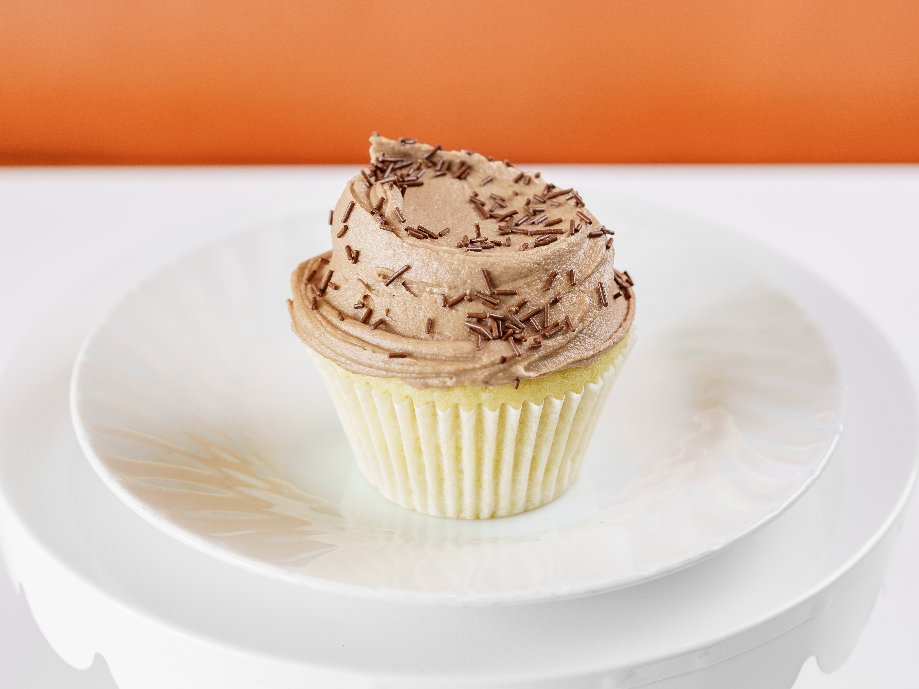 Order Royal White / Nutella Buttercream Cupcake food online from Frosted Cupcakery store, Long Beach on bringmethat.com