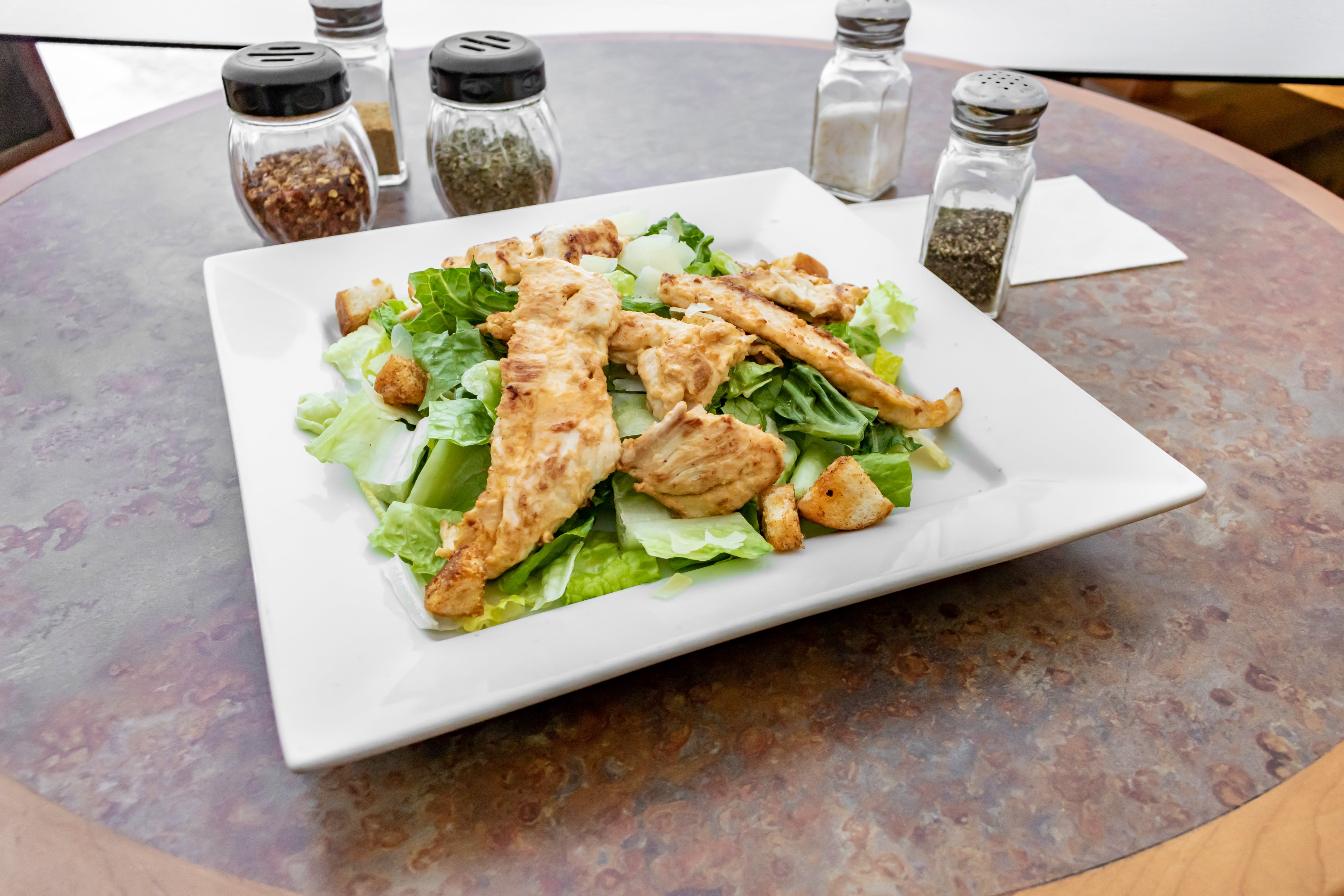 Order Chicken Caesar Salad - Salad food online from Rino Pizzeria & Restaurant store, Burlington on bringmethat.com
