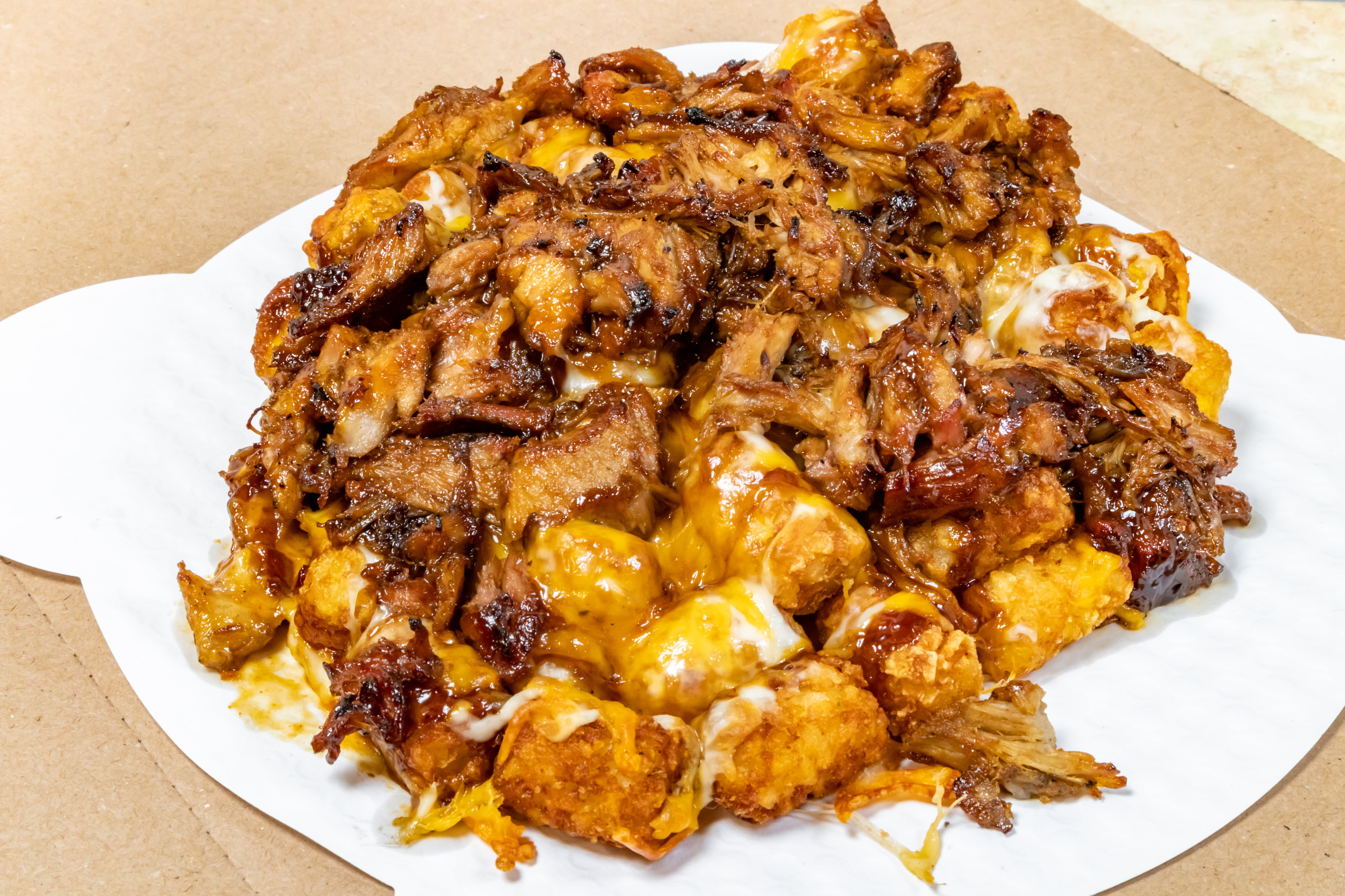Order Pulled Pork Tater Tots - Regular food online from Novotny's Groceries & Pizza store, Worthington on bringmethat.com