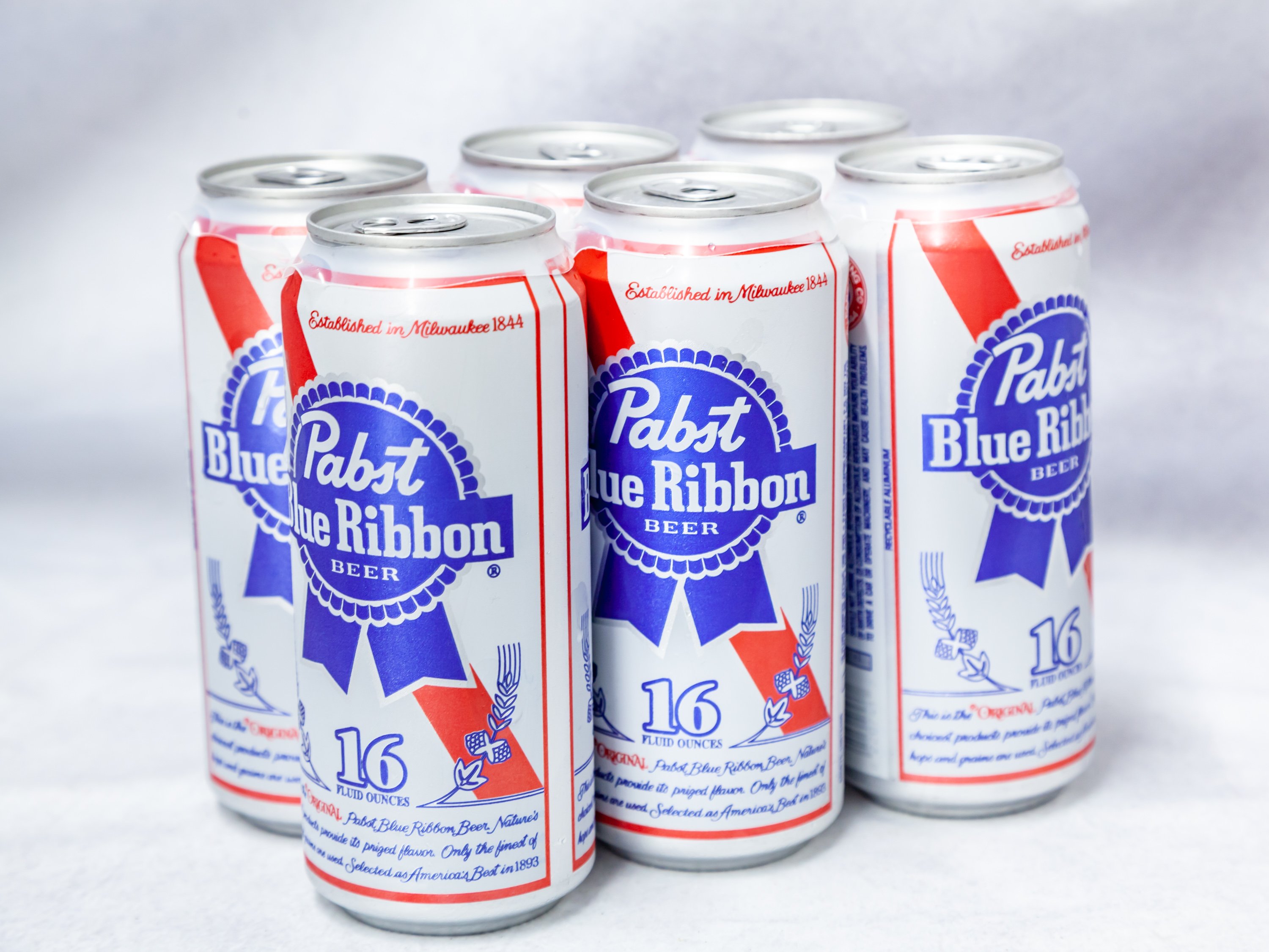 Order 6 Pack Can Pabts Blue Ribbon (16oz) food online from Gallaghers Drive-In Liquor store, Oakland on bringmethat.com