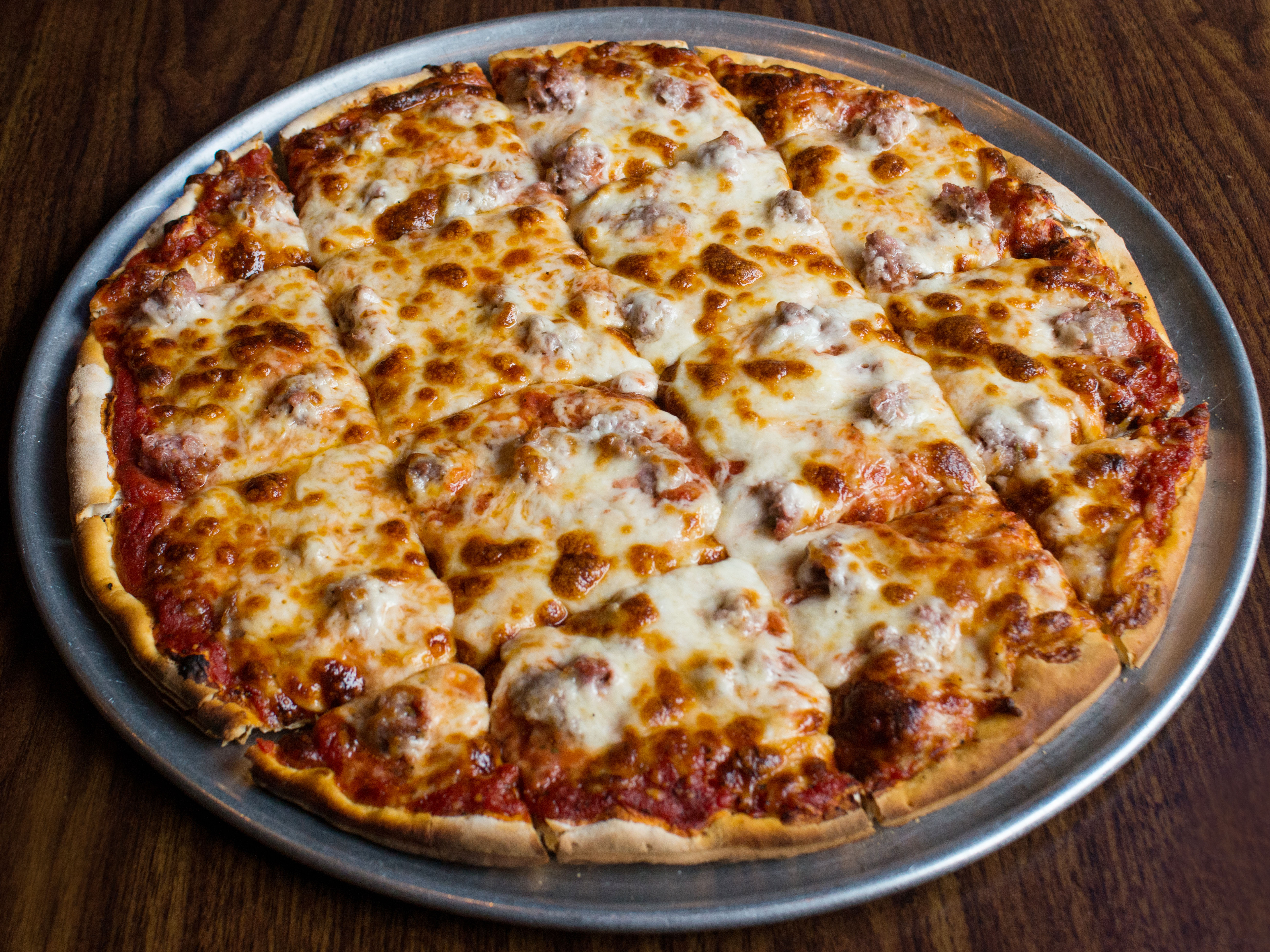 Order 14" Thin Crust Cheese Pizza food online from Bringer Inn store, Morton Grove on bringmethat.com