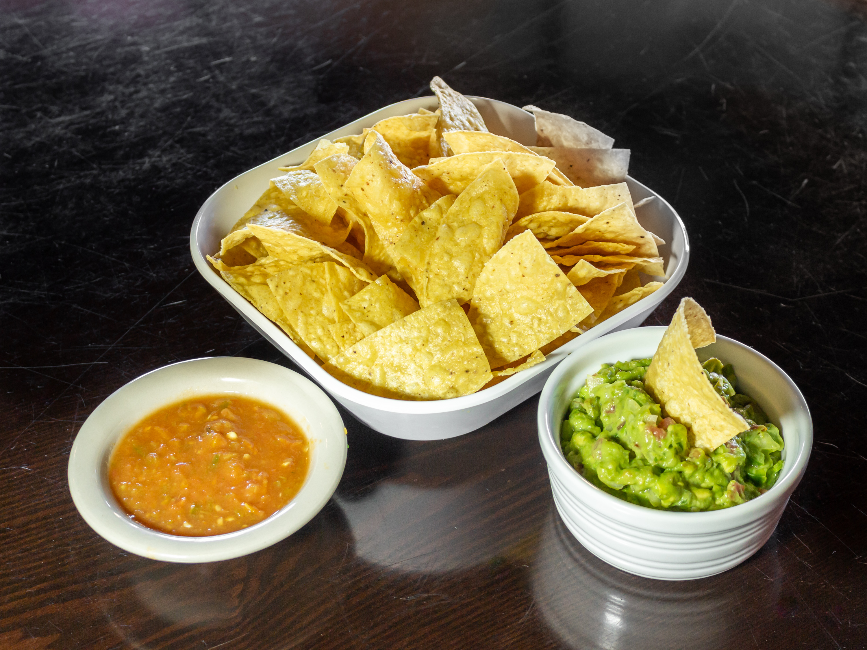 Order Guacamole and Chips food online from Mojitos Mexican Bar & Grill store, Odessa on bringmethat.com