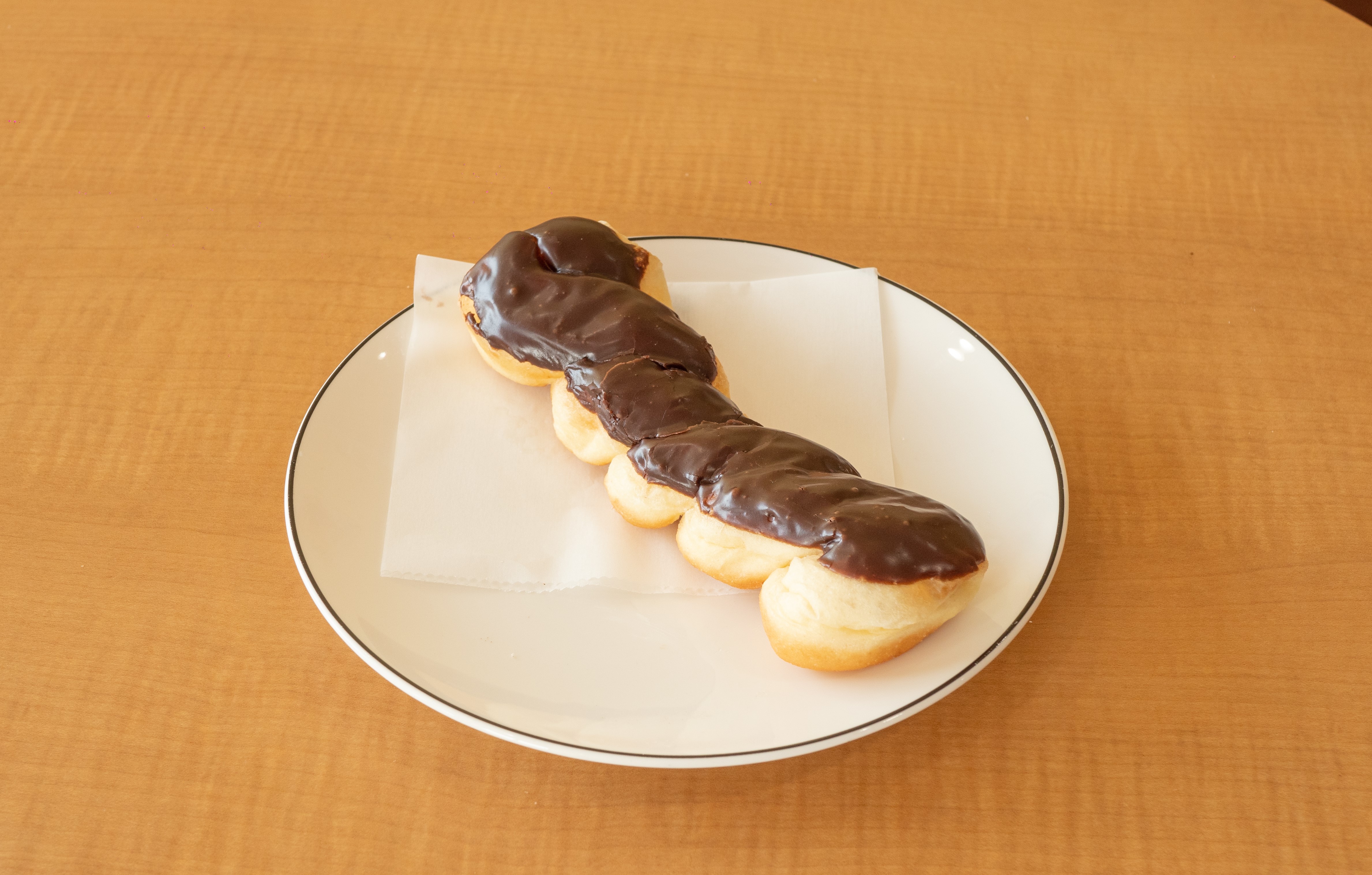 Order 1 Piece Twist Chocolate food online from Sara Donuts store, Euless on bringmethat.com