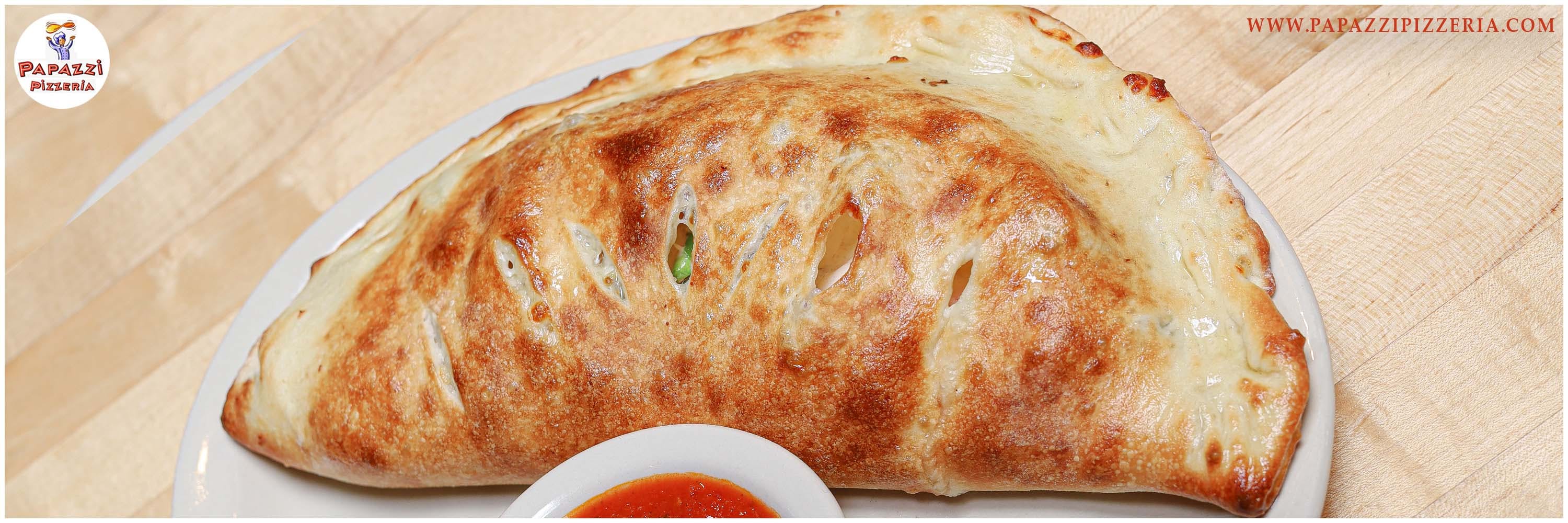 Order Meat Calzone - Calzone food online from Papazzi Pizzeria store, Bellevue on bringmethat.com