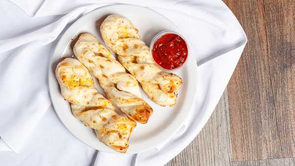 Order Garlic Parmesan Twists (3 Pieces) food online from Round Table Pizza store, San Rafael on bringmethat.com