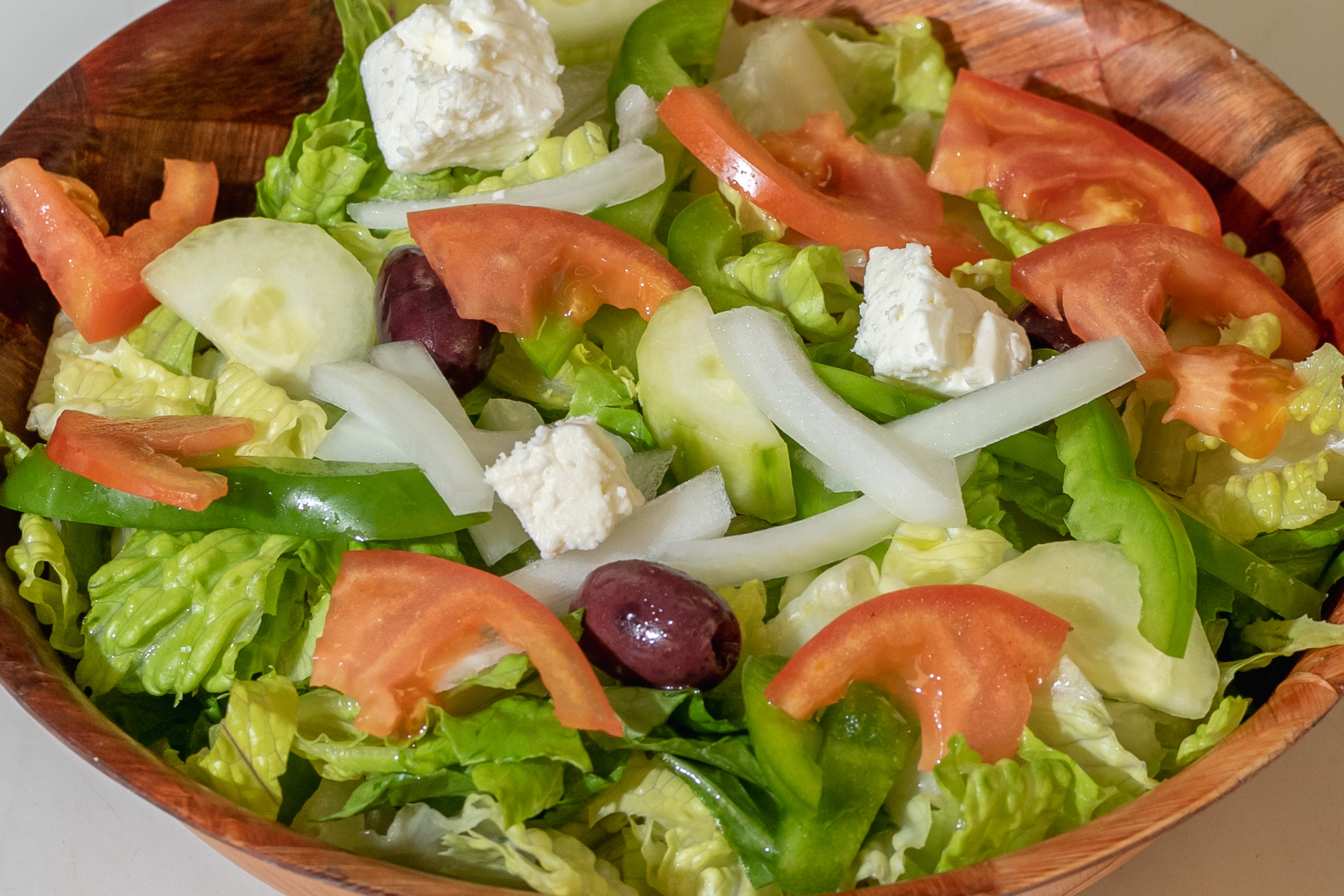 Order Greek Salad food online from Tortorice's Pizza & Catering store, Chicago on bringmethat.com