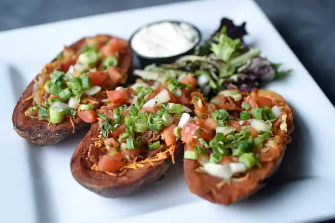 Order Hand Scooped Potato Skins food online from Grindstone Tap House store, Berea on bringmethat.com