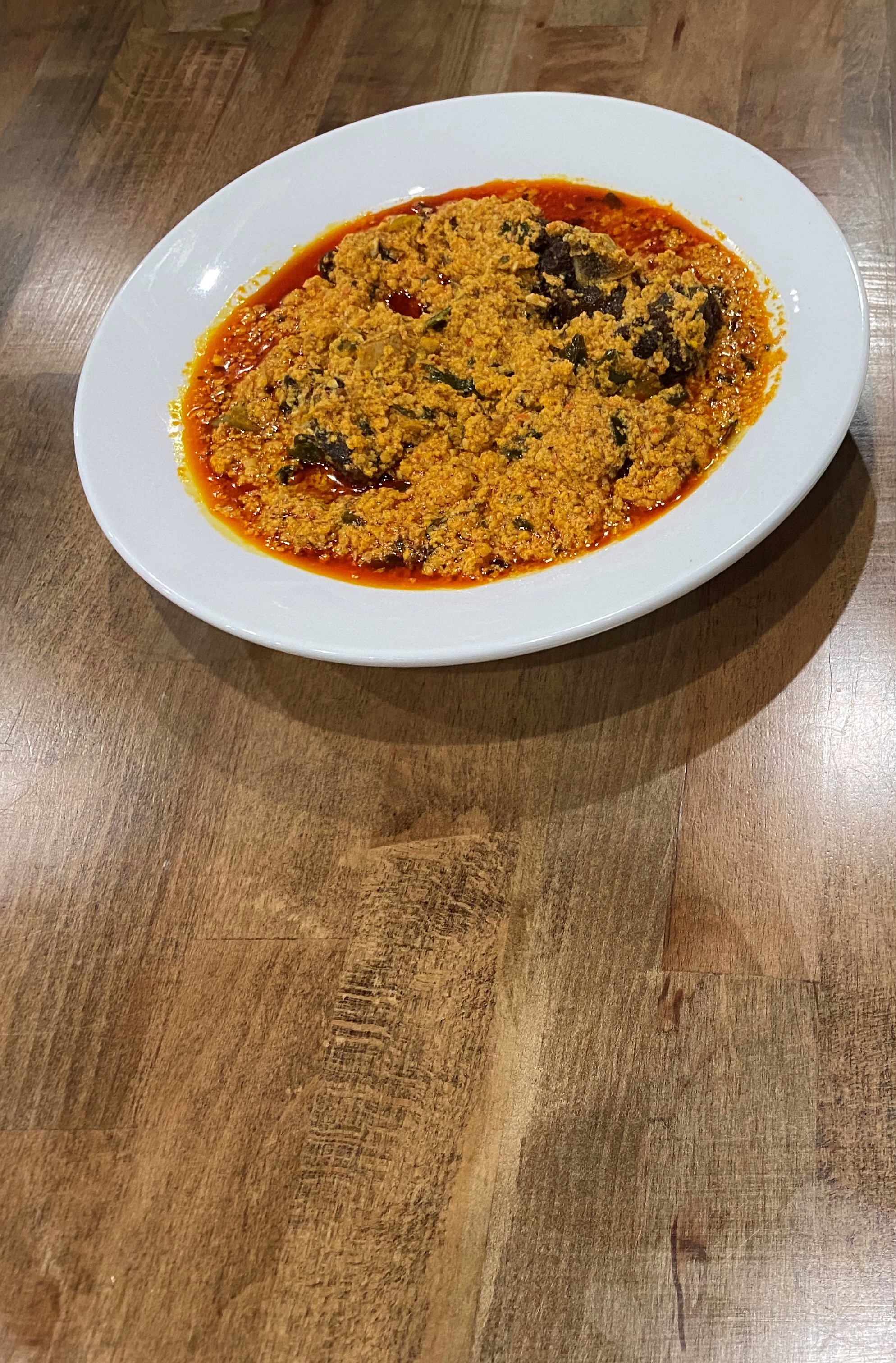 Order Egusi Soup + Beef food online from Fusion Vibes Kitchen + Bar store, Richardson on bringmethat.com