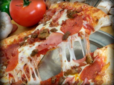 Order Carnivore's Feast Pizza food online from B.C. Pizza store, McDonough on bringmethat.com