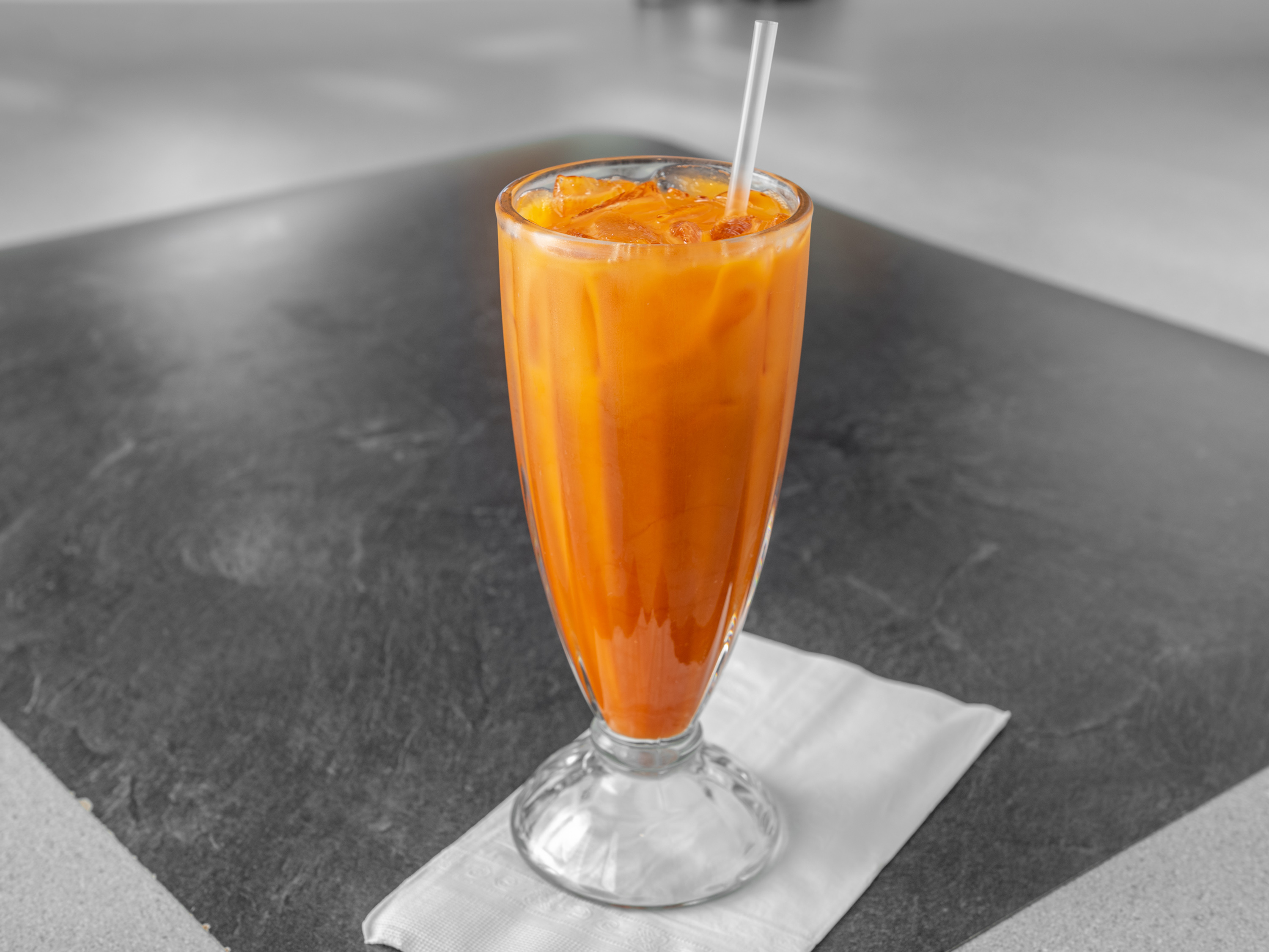 Order Thai Ice Tea food online from Thai Noodles Cafe store, Libertyville on bringmethat.com