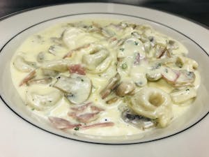 Order Tortellini alla Panna food online from Alfonso's Italian Restaurant store, Dallas on bringmethat.com