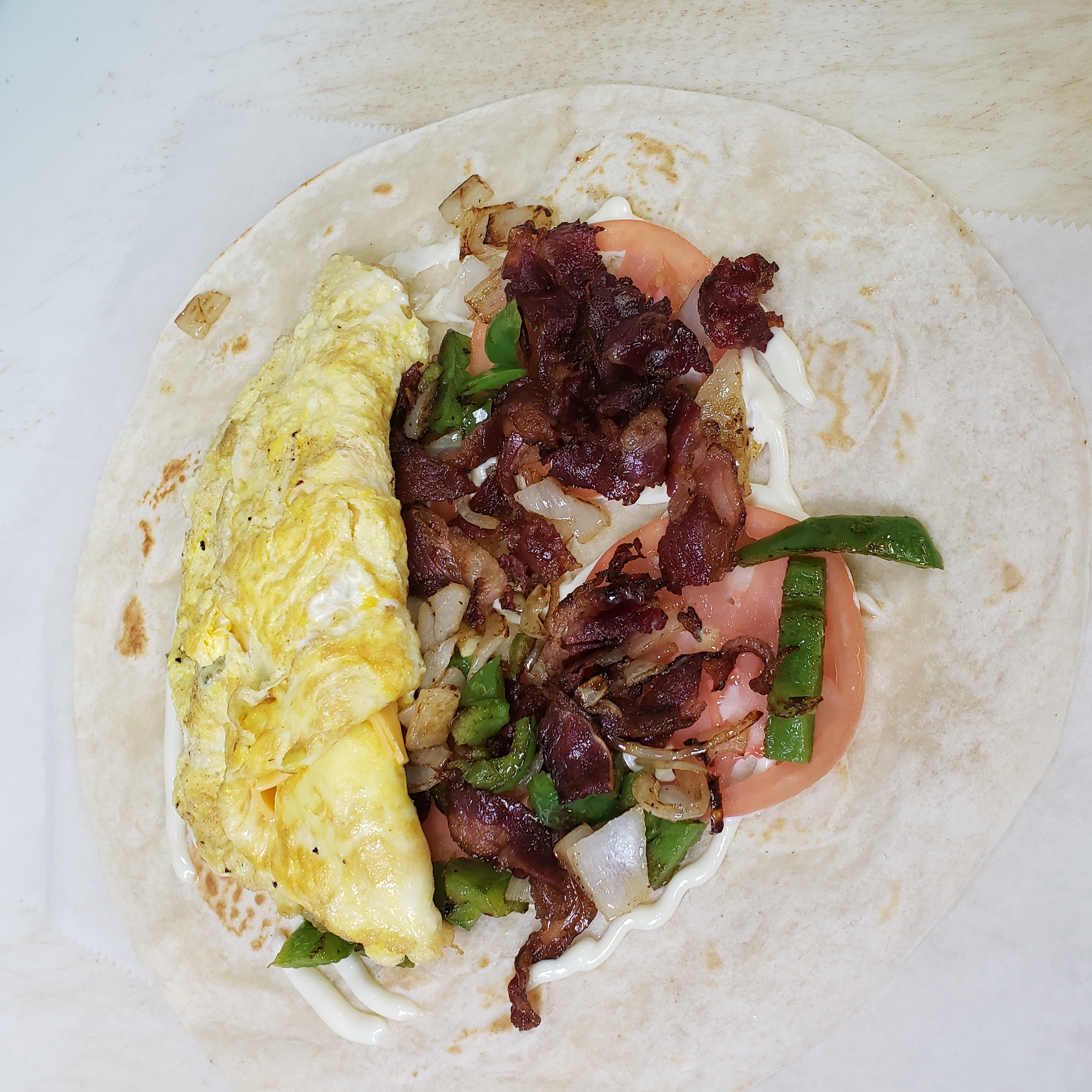 Order Egg Wrap with Beef Bacon food online from S. Gardens Deli store, Springfield Gardens on bringmethat.com