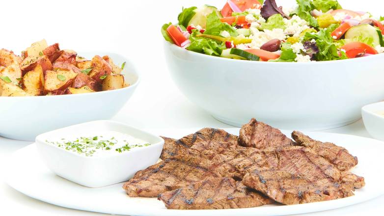 Order Grilled Lamb Family Feast for 4 food online from Taziki Mediterranean Cafe store, Memphis on bringmethat.com