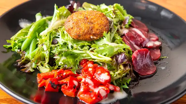 Order Warm Goat Cheese Salad food online from The Village Grill store, Raleigh on bringmethat.com