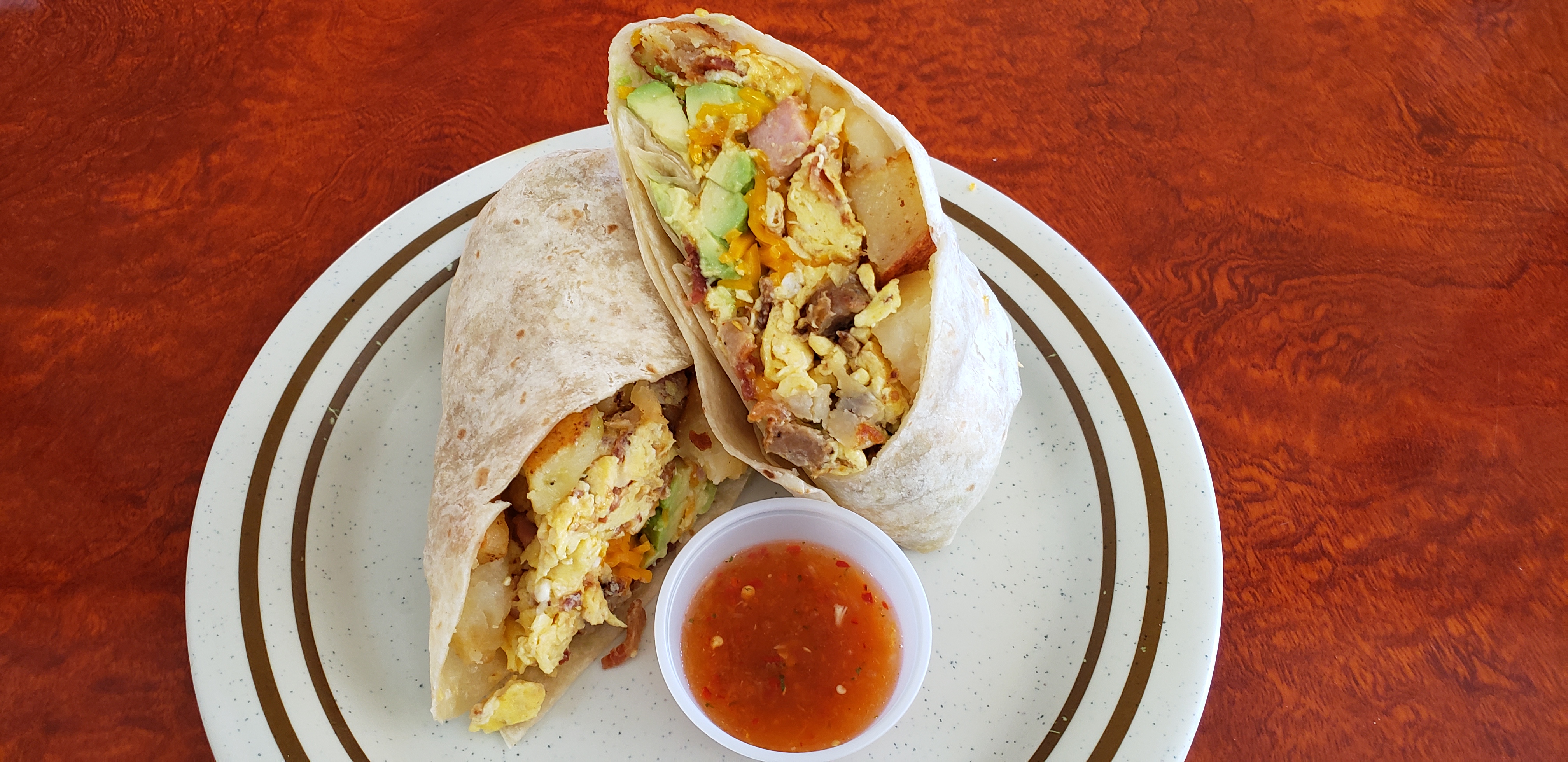 Order 3 Eggs Cheddar Cheese Burrito with Bacon food online from Breakfast Cafe store, Oak Park on bringmethat.com