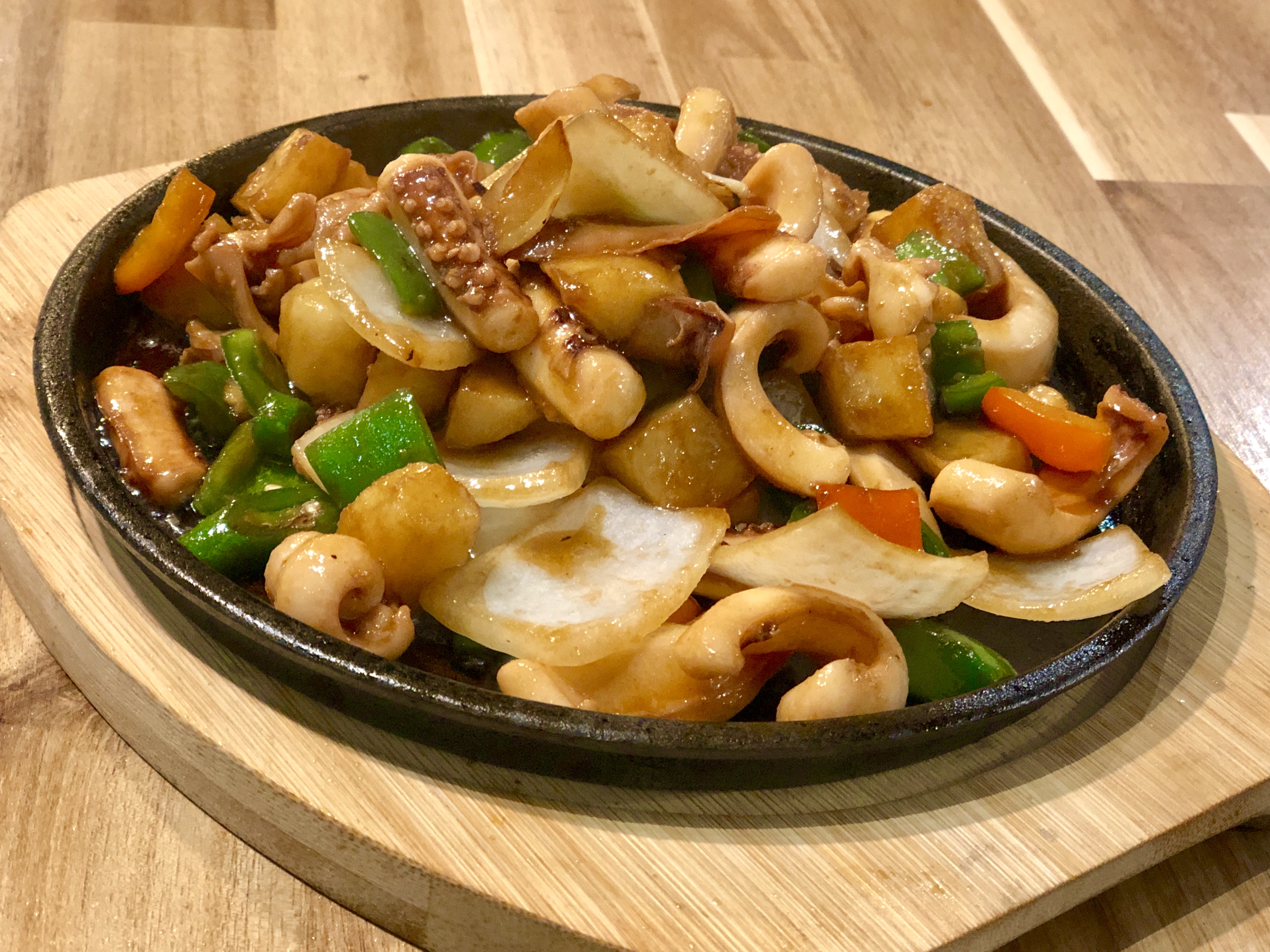 Order 522. Sizzling Squid Plate food online from Years Asian Bistro & BBQ store, Tucson on bringmethat.com
