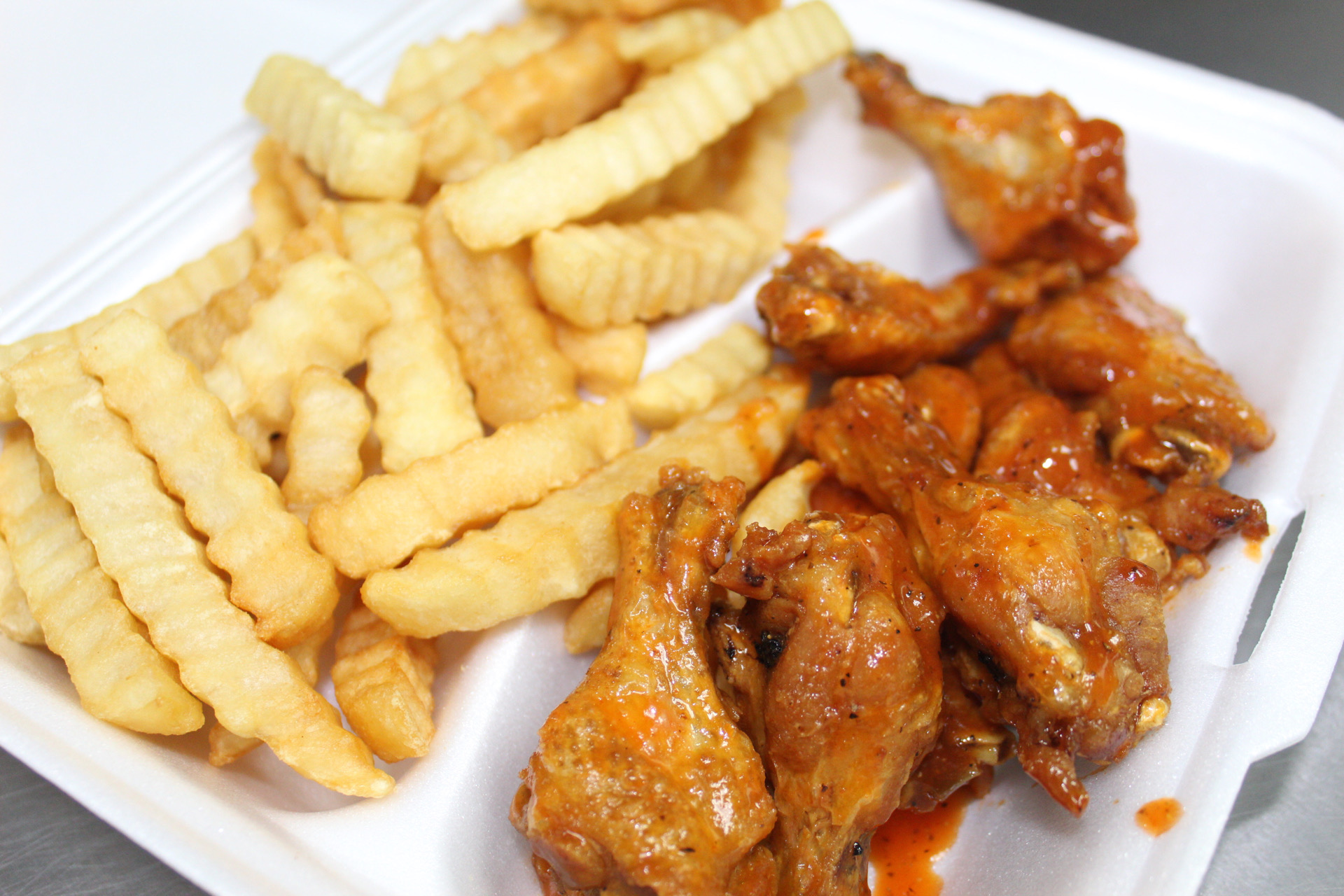 Order F. Buffalo Chicken Wings with French Fries food online from Yummy Taco store, Inwood on bringmethat.com