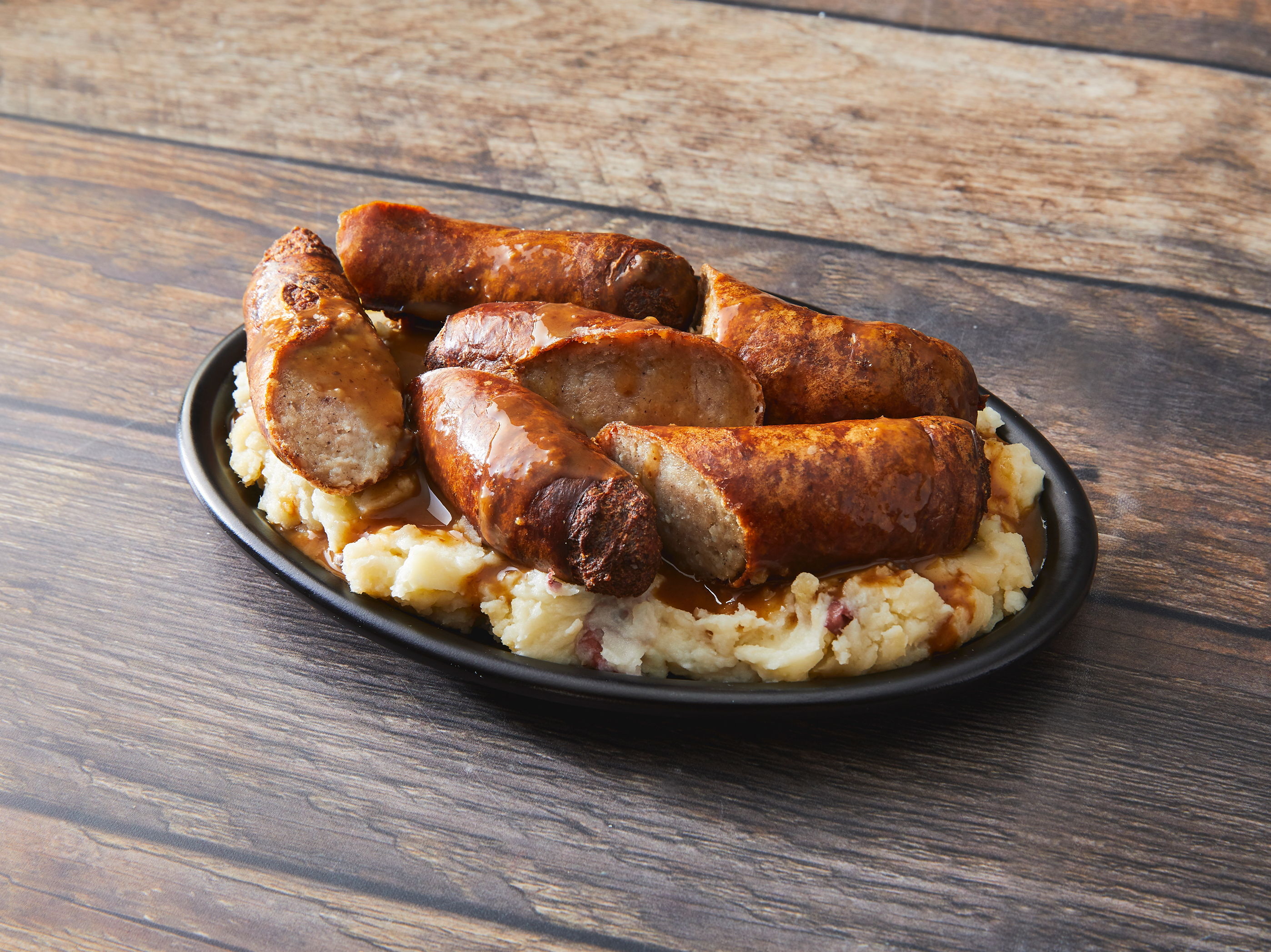 Order Bangers and Mash food online from The Curragh Irish Pub store, Chicago on bringmethat.com