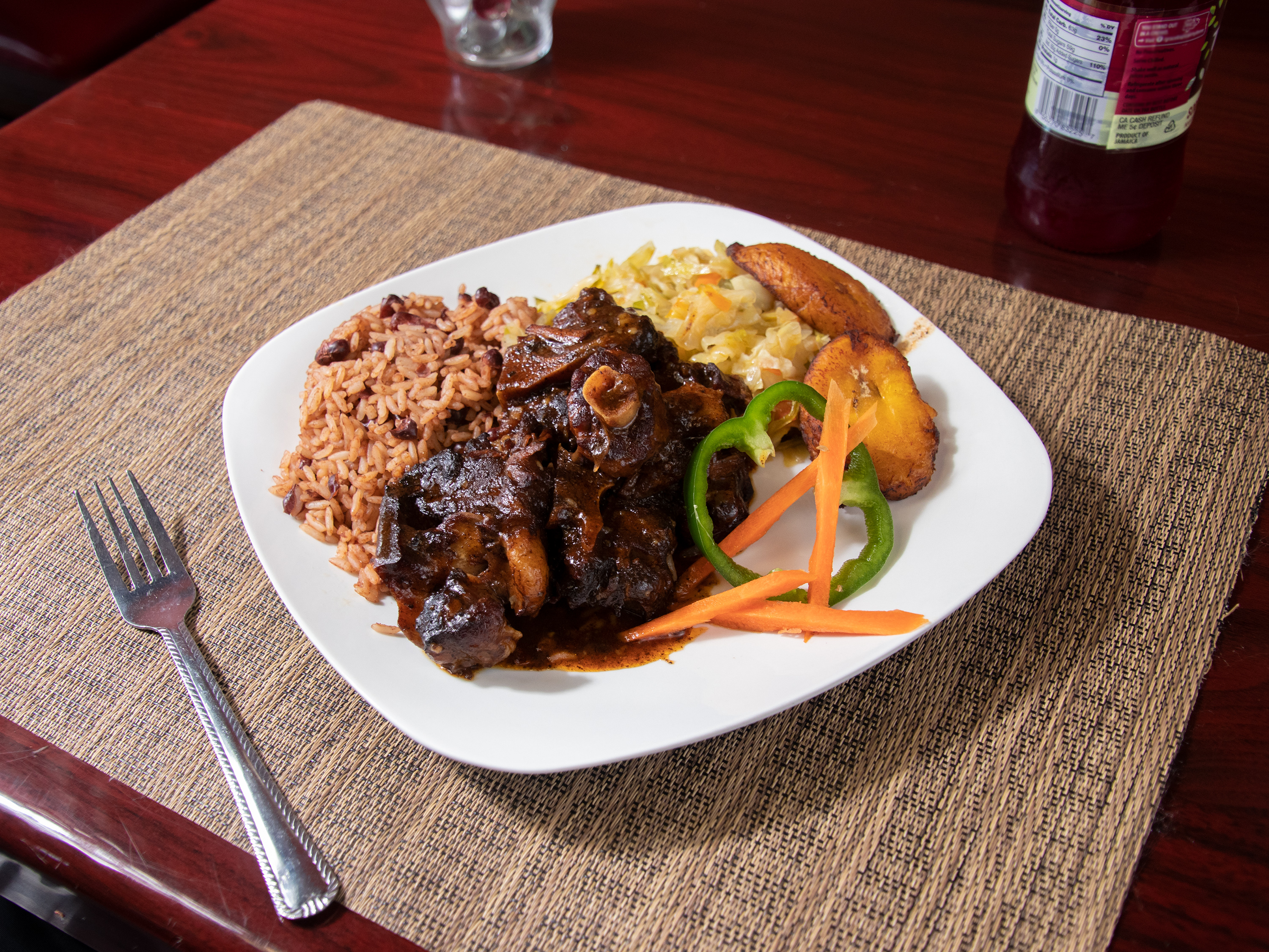 Order Braised Oxtail food online from Golden Krust Caribbean Restaurant store, Morrow on bringmethat.com