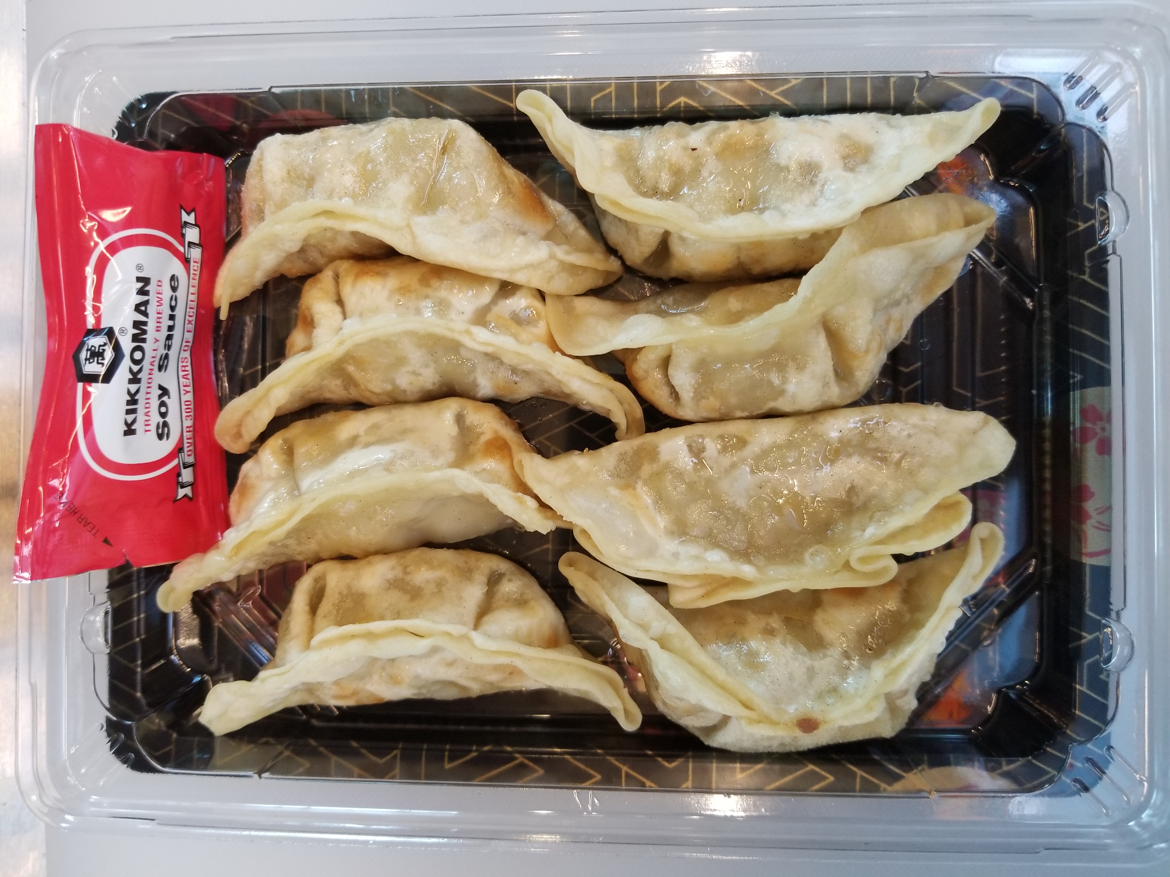 Order A2. Dumplings 8pcs food online from Noodle N Roll store, Orem on bringmethat.com