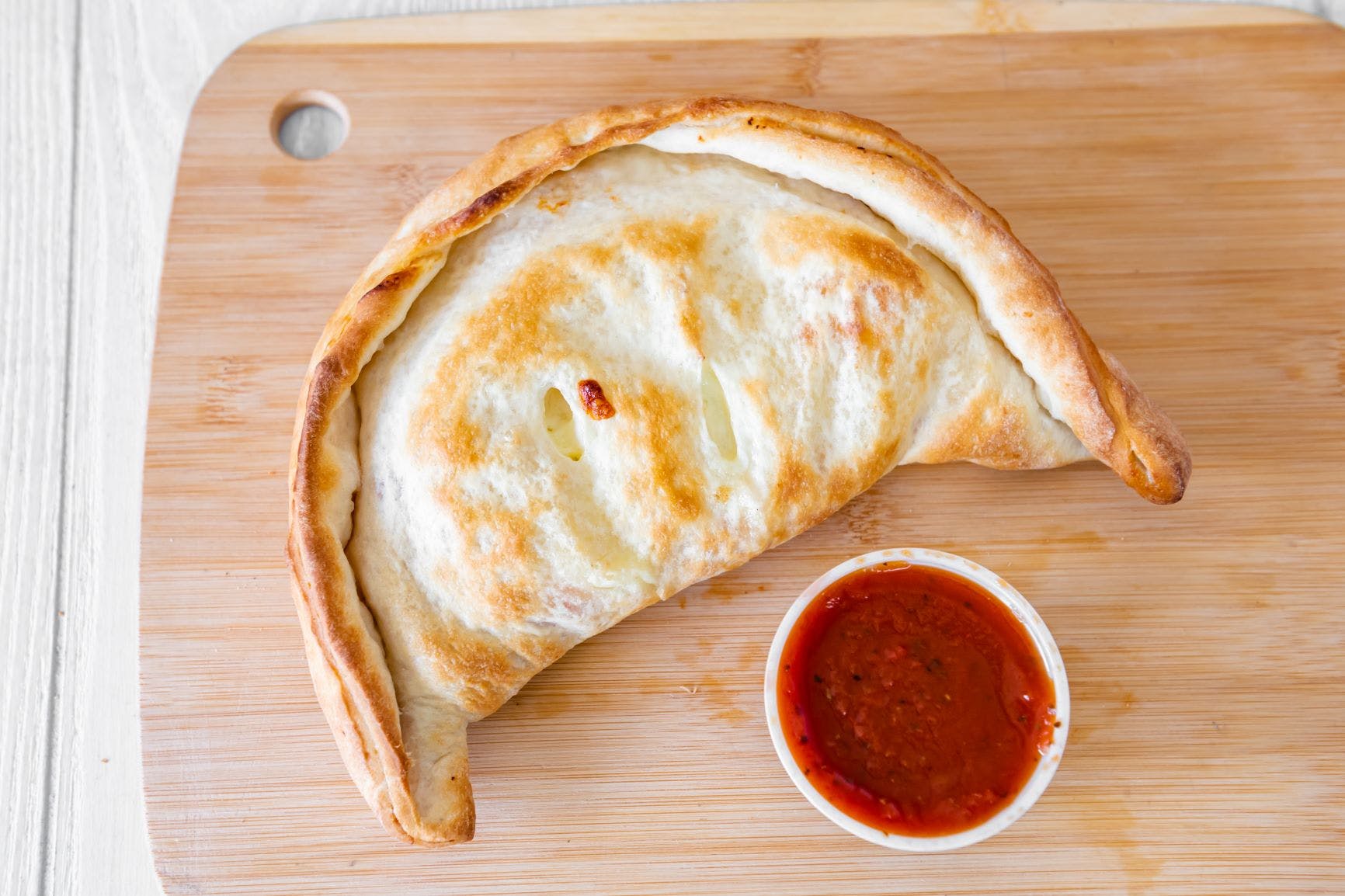 Order Calzone with Ham, Cheese & Sauce - Calzone food online from Joe's Pizza store, Easton on bringmethat.com