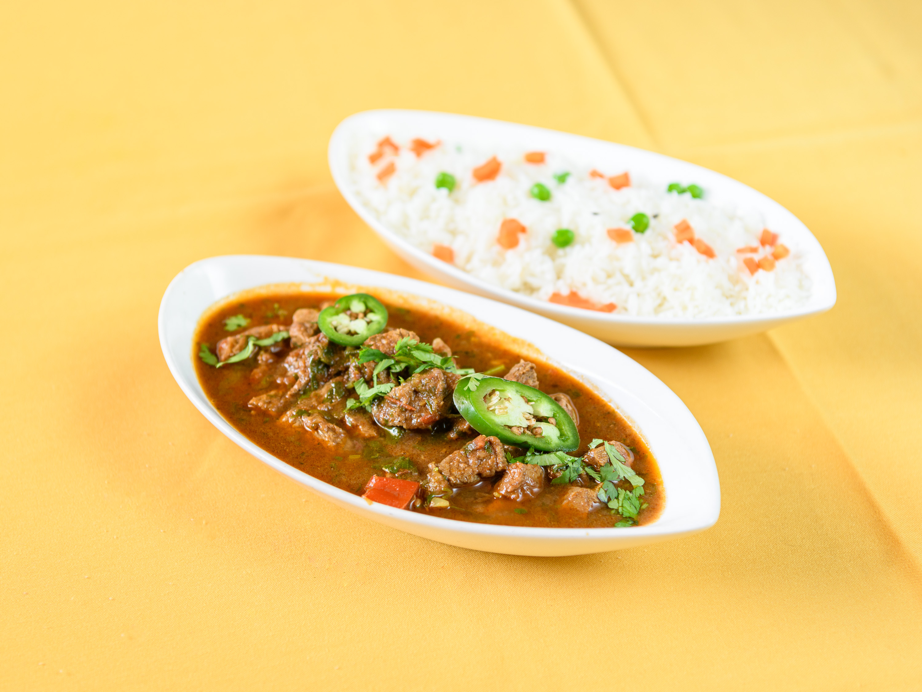 Order Lamb Curry food online from Taj Cuisine of India store, Oklahoma City on bringmethat.com
