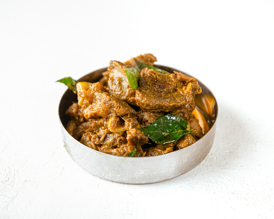 Order Travancore Goat Roast (GF) food online from Southern Spice store, Irvine on bringmethat.com