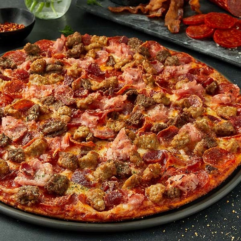Order Serious Meat™ Pizza - Individual 7" food online from Donatos Pizza store, Hudson on bringmethat.com