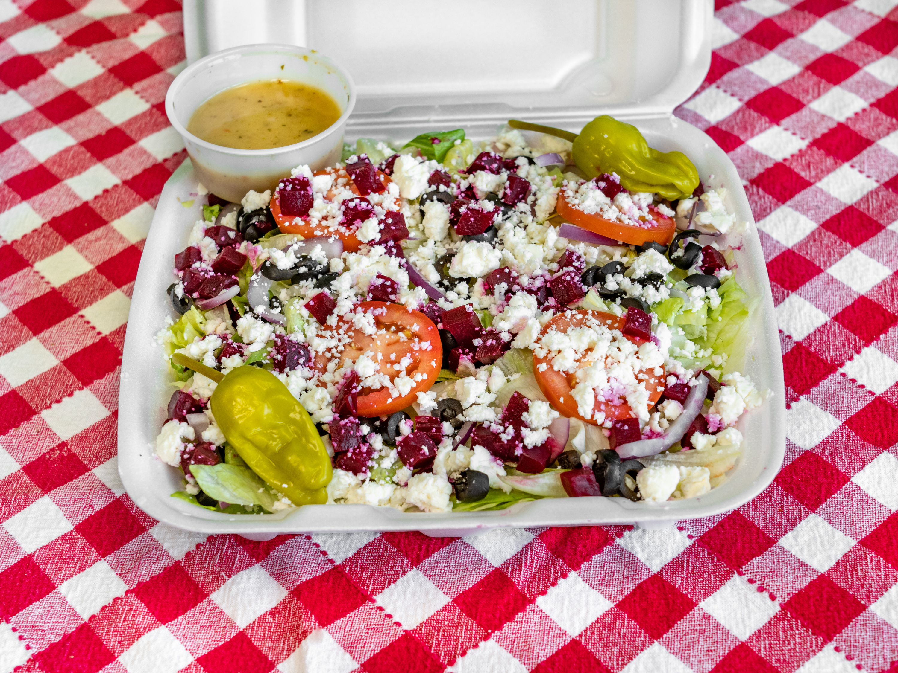 Order Greek Salad food online from What Up Dough Pizzeria store, Utica on bringmethat.com