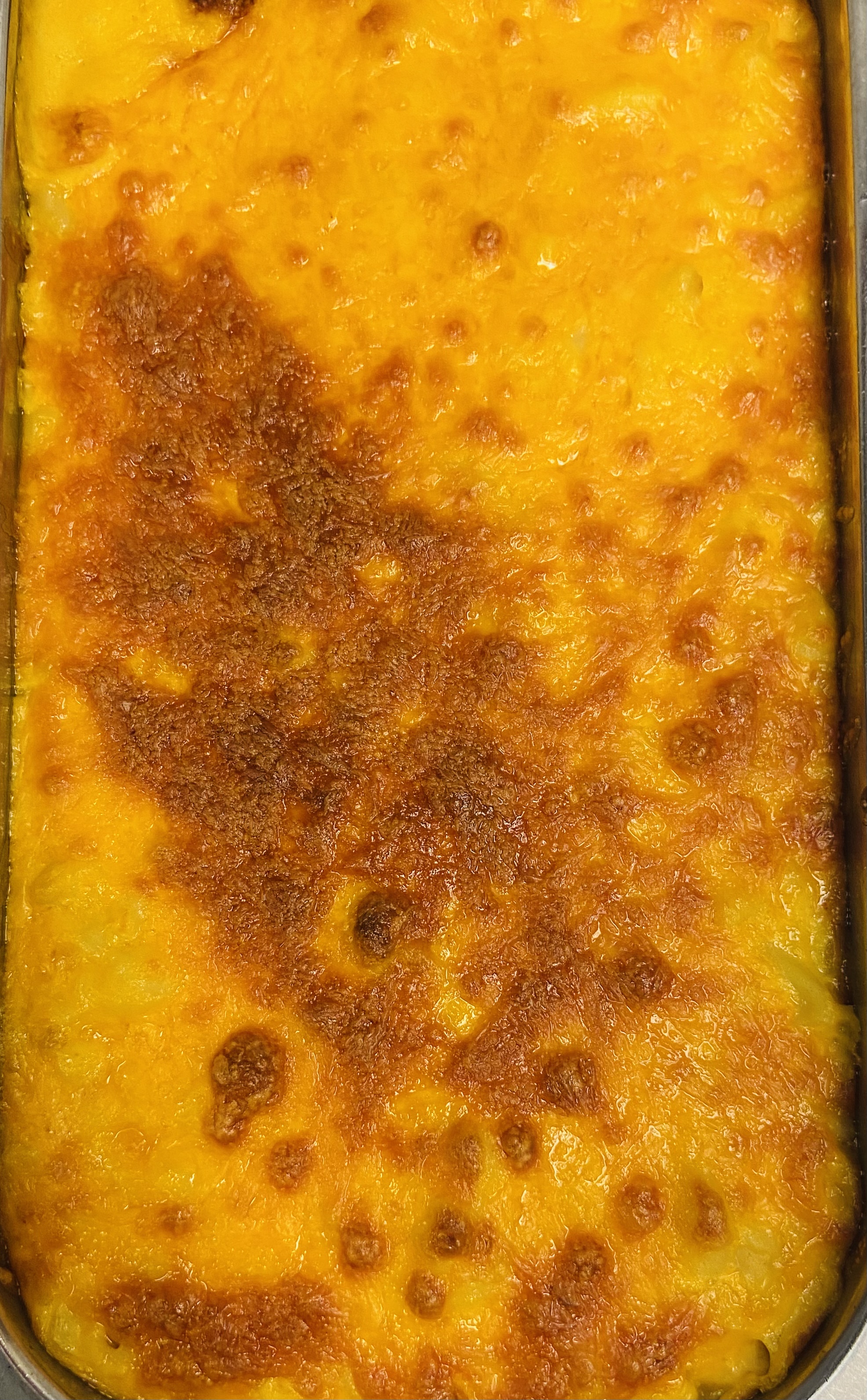 Order Baked Macaroni and Cheese food online from Mum's Jamaican Restaurant store, Raleigh on bringmethat.com