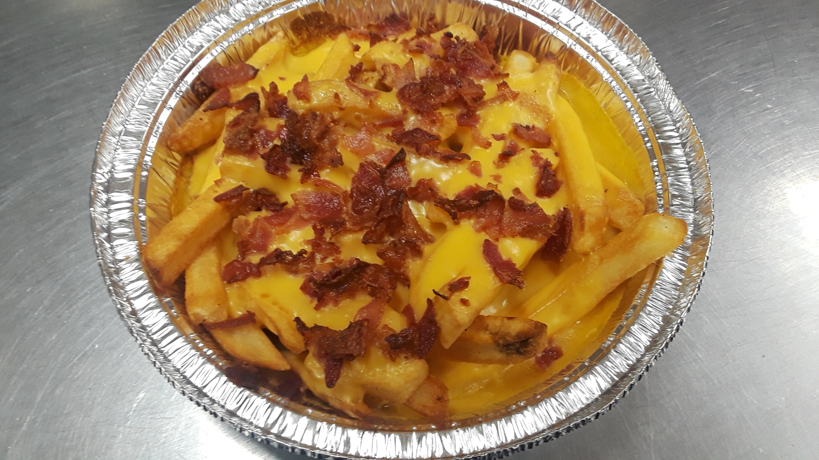 Order Bacon Cheese Fries - Appetizer food online from Pizzeria Santa Lucia store, Jessup on bringmethat.com