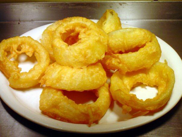 Order Hand Battered Onion Rings food online from Rockets Cafe store, Toledo on bringmethat.com