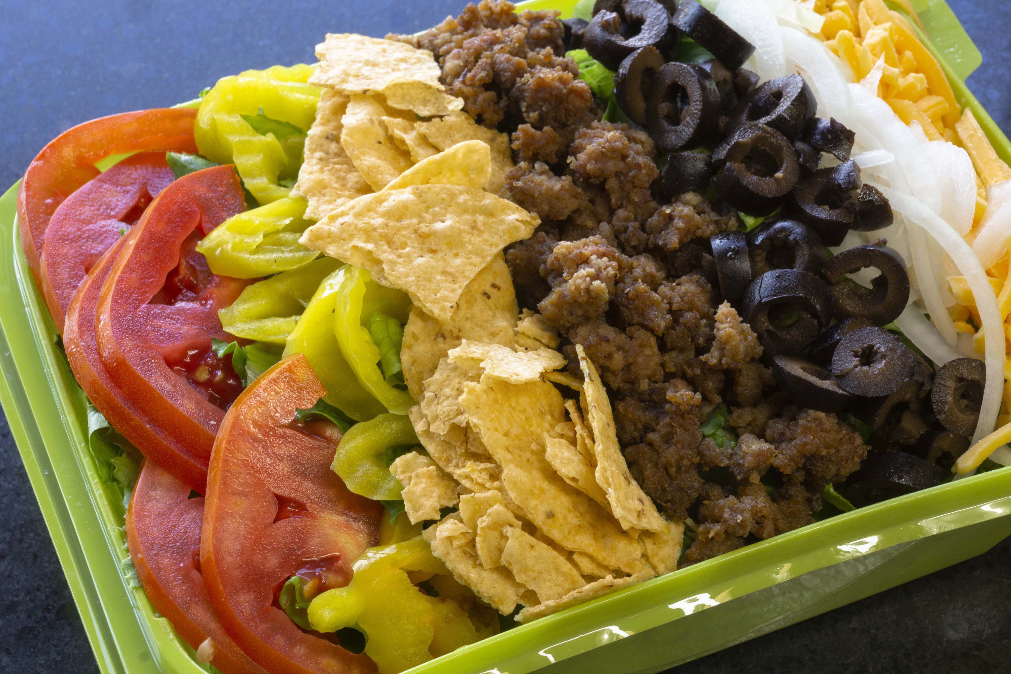 Order Beef Taco Salad food online from Tubbys Sub Shop & Just Baked Cupcakes store, Wixom on bringmethat.com