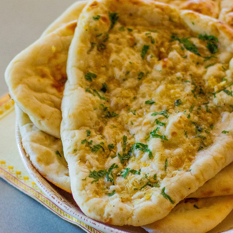 Order Garlic Naan food online from Great Himalayan Indian Cuisines store, Moore on bringmethat.com