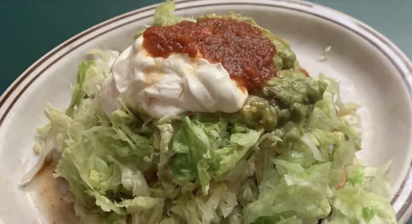 Order Deluxe Tostada food online from Celia's Mexican Restaurant store, Antioch on bringmethat.com