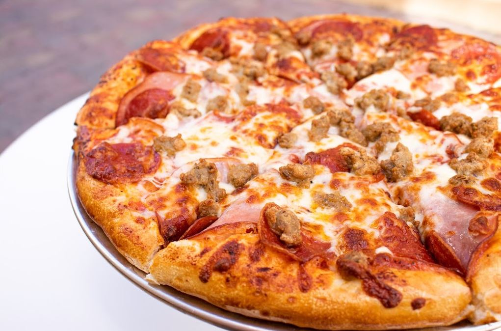 Order 3 Meat Specialty Pizza food online from 4 Eggs & Pizza store, Santa Barbara on bringmethat.com