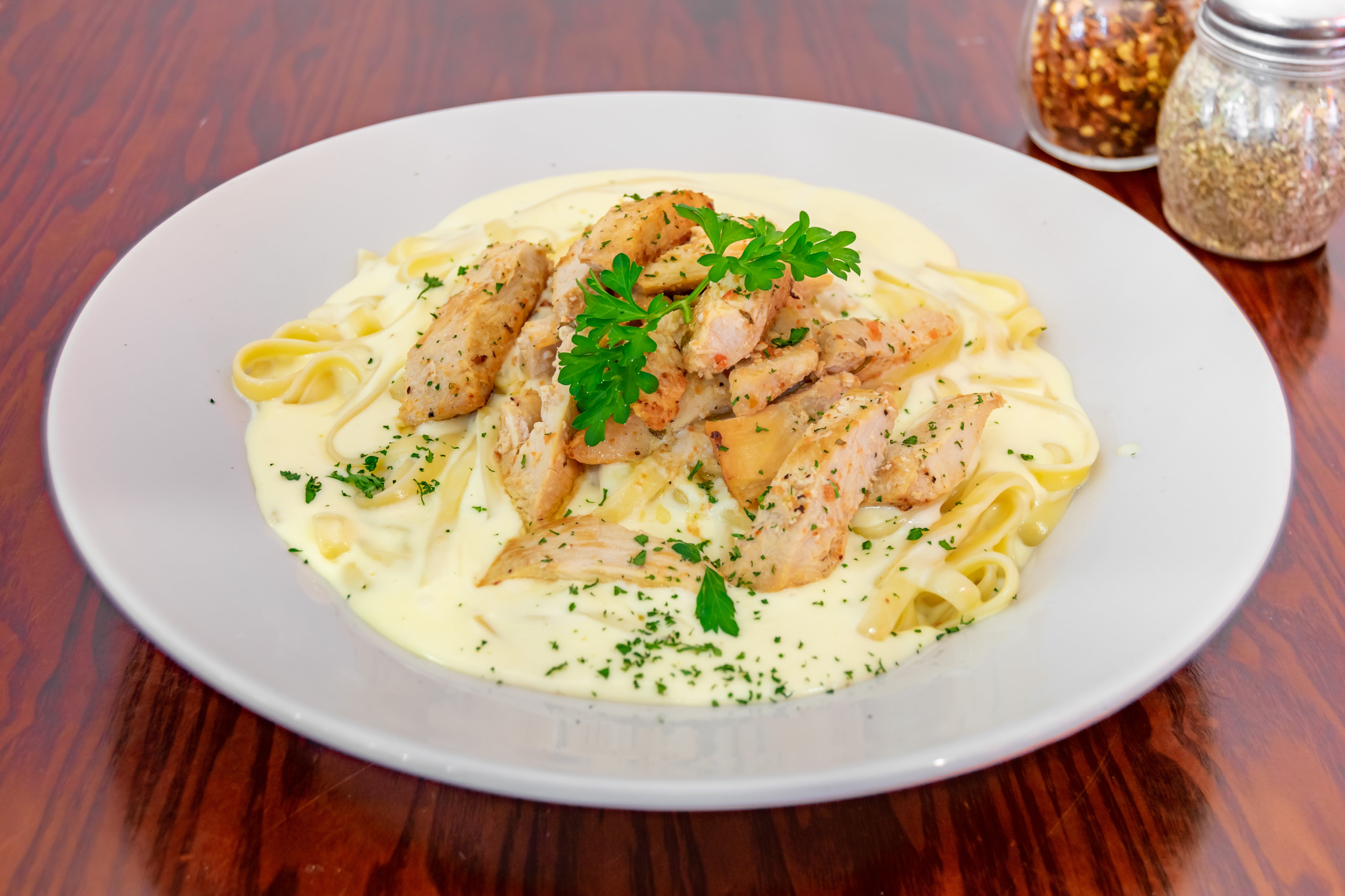 Order Pasta with Alfredo Sauce & Chicken - Pasta food online from Giovannis Pizzeria store, Levittown on bringmethat.com